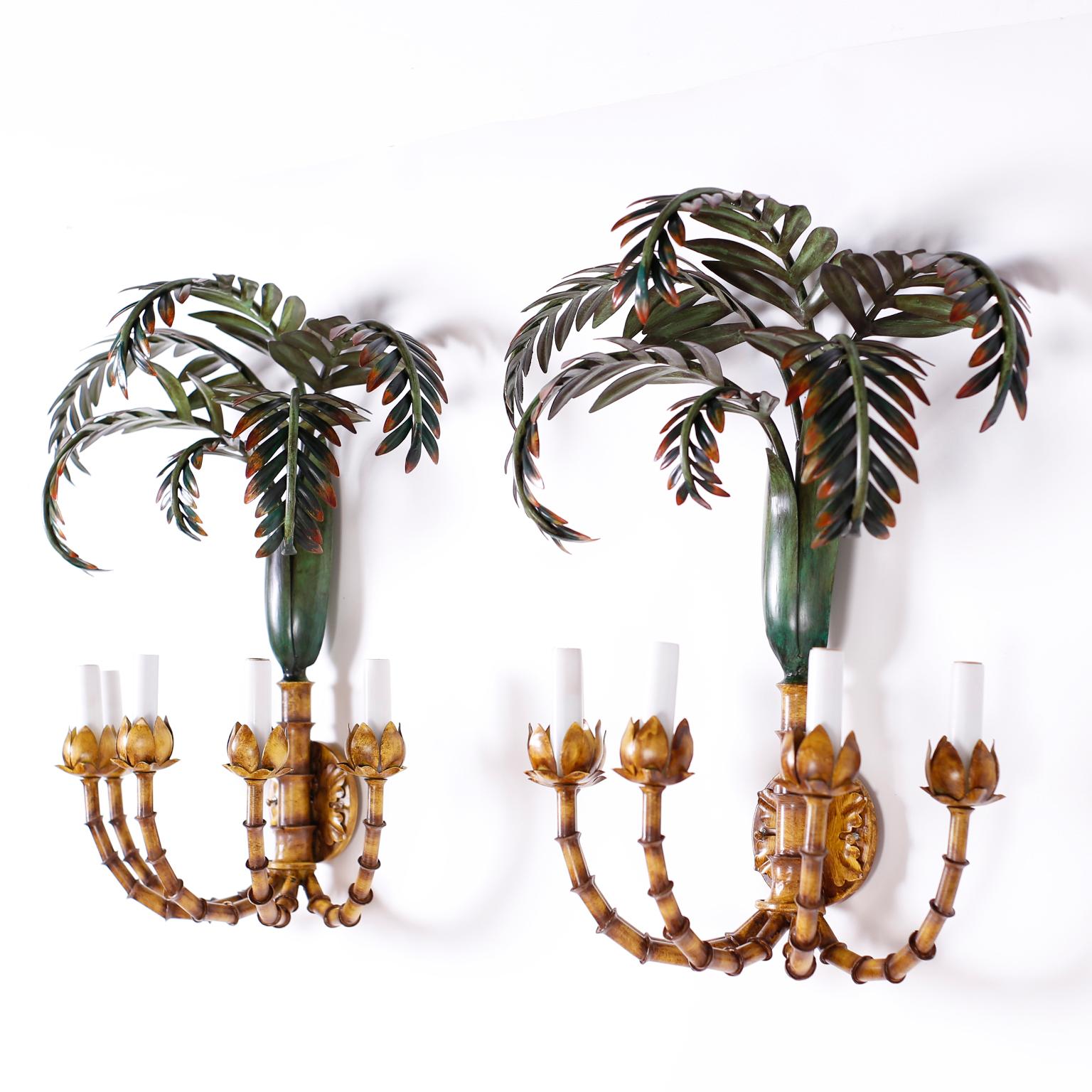 Pair of Italian tole or painted metal wall sconces with palm trees at the top and five faux bamboo arms supporting electrified candle cups.