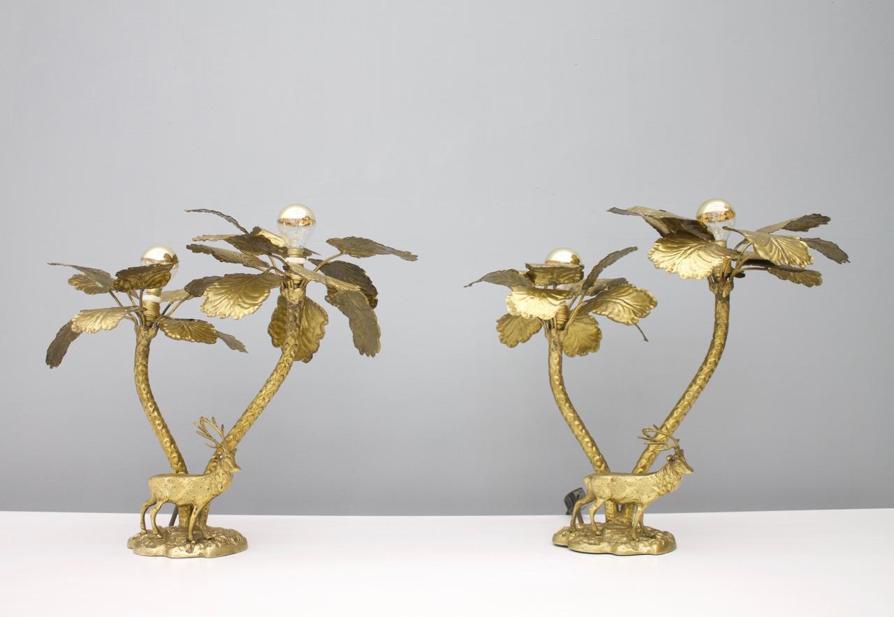 Nice pair of palm tree brass table lamps with a deer.
Good original condition.
