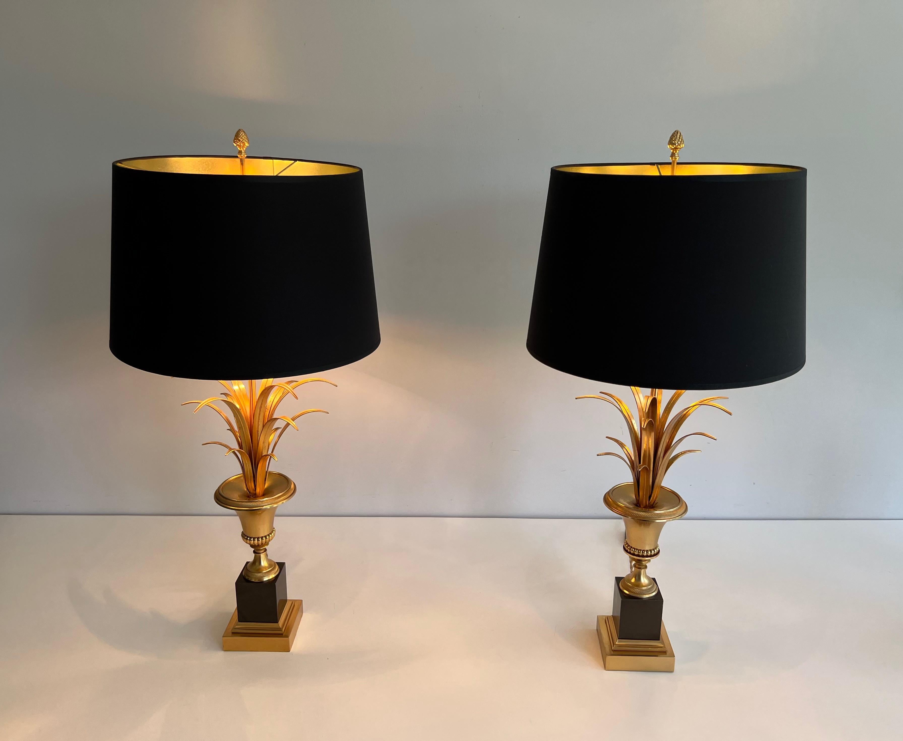 This pair of palm tree neoclassical style wall Lights is made of chrome and brass. This isi a French work in the style of Maison Charles. Circa 1970