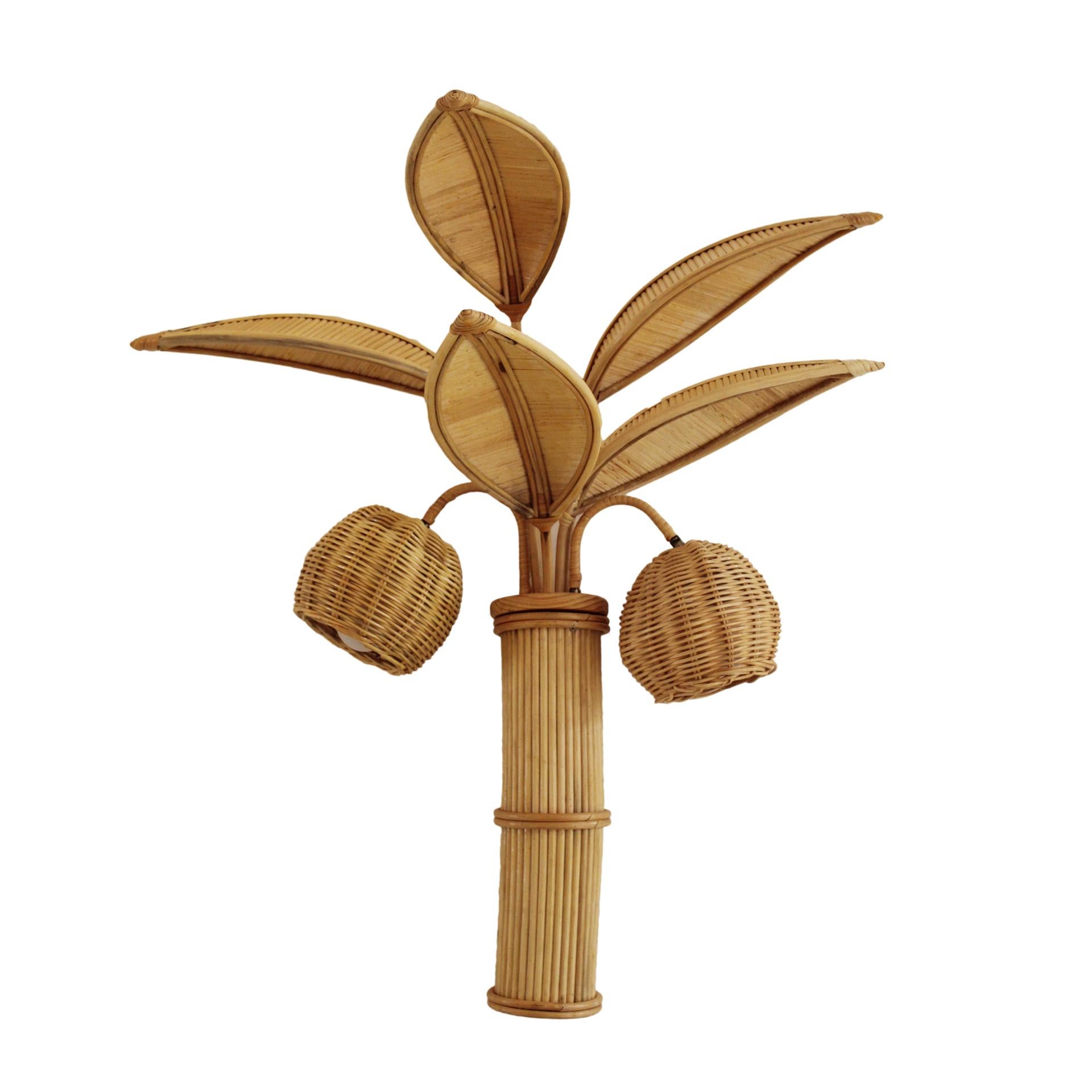 Pair of bamboo and braided rattan wall lamps in the shape of a palm tree. Italy 80s.
 