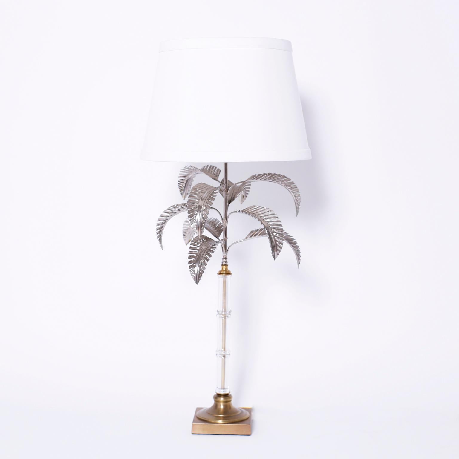 Pair of midcentury palm tree table lamps with stylized silvered metal palm leaves, faux bamboo glass stems, and Classic brass bases.
  