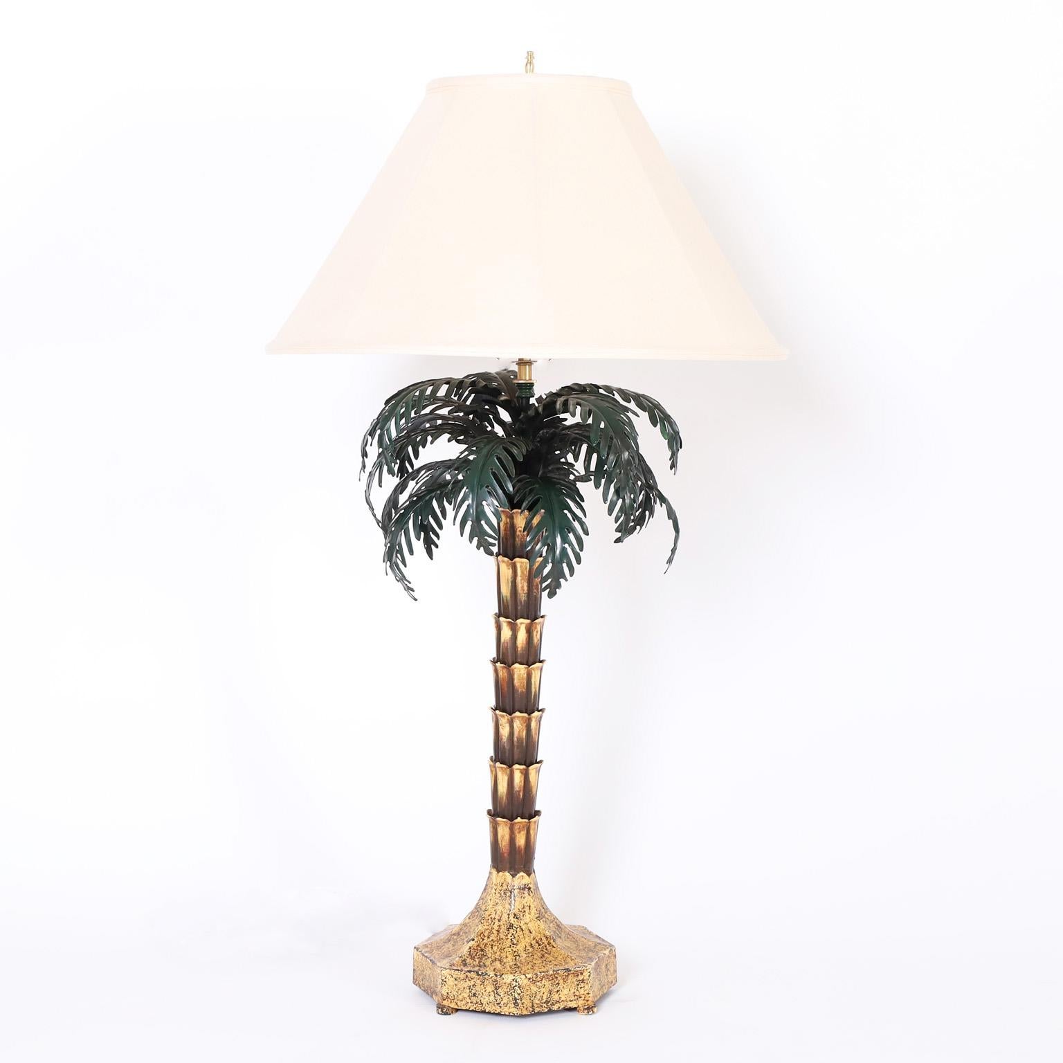Standout pair of British colonial style large scale Italian tole or painted metal lamps in the form of stylized palm trees.