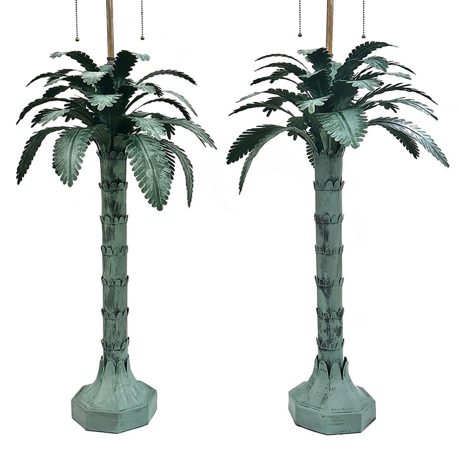 Pair of circa 1940's painted tole French table lamps in the form of palm trees with original finish.

Measurements:
Height of body: 29