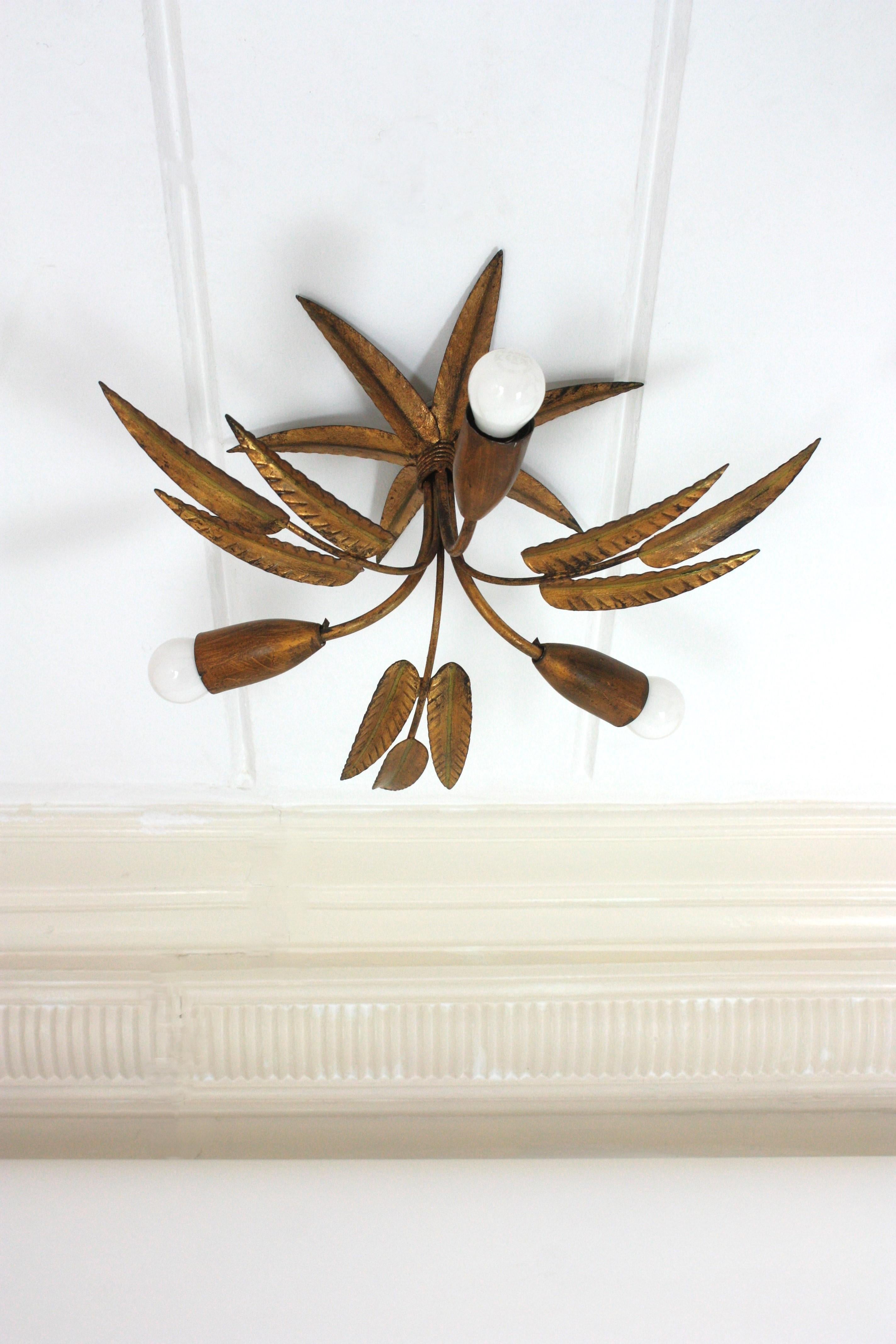 Hand-Crafted Pair of Palmette Chandeliers or Pendants in Gilt Iron with Leaves Design For Sale