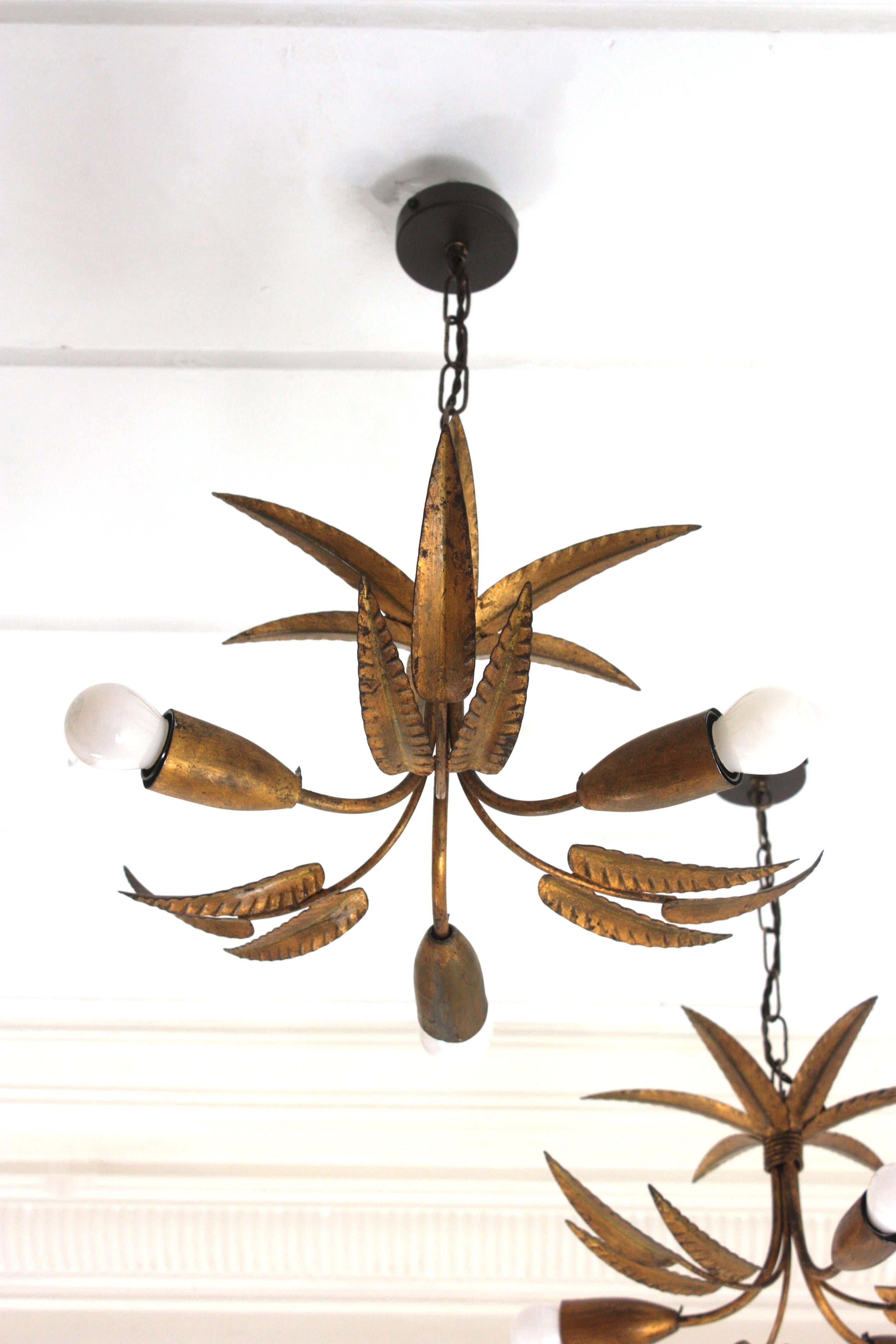 Metal Pair of Palmette Chandeliers or Pendants in Gilt Iron with Leaves Design For Sale