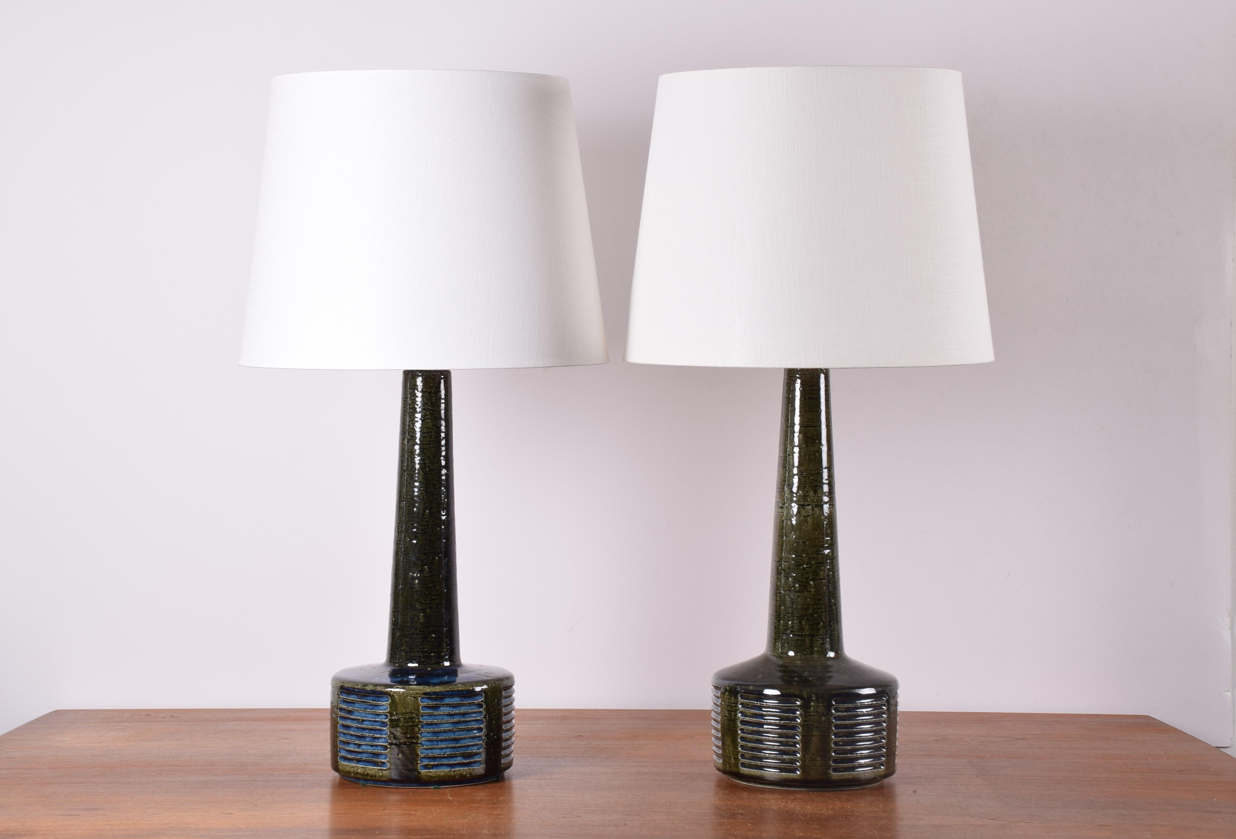 Pair of vintage Palshus Denmark tall ceramic lamps including new quality lamp shades!

The lamps were designed by Per Linnemann-Schmidt and produced circa 1960s. The glaze is bottle green with cobalt blue and they are made with chamotte clay which