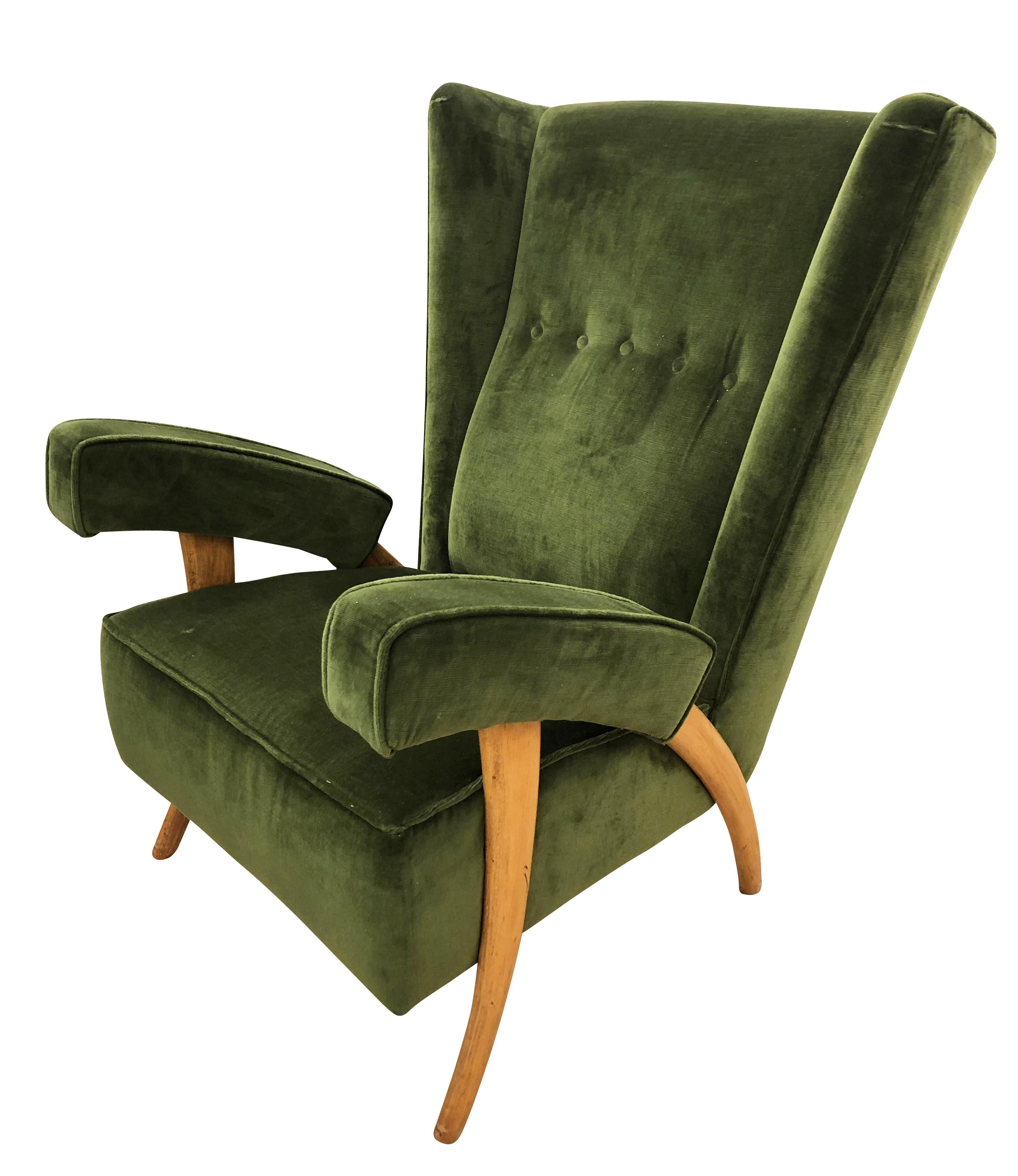 Pair of beautiful 1950s Paolo Buffa lounge chairs with “tusk” shaped legs. Upholstered in a dark green velvet.

Condition: Excellent vintage condition, minor wear consistent with age and use.

Measures: Width 28”

Depth 31”.

Height
