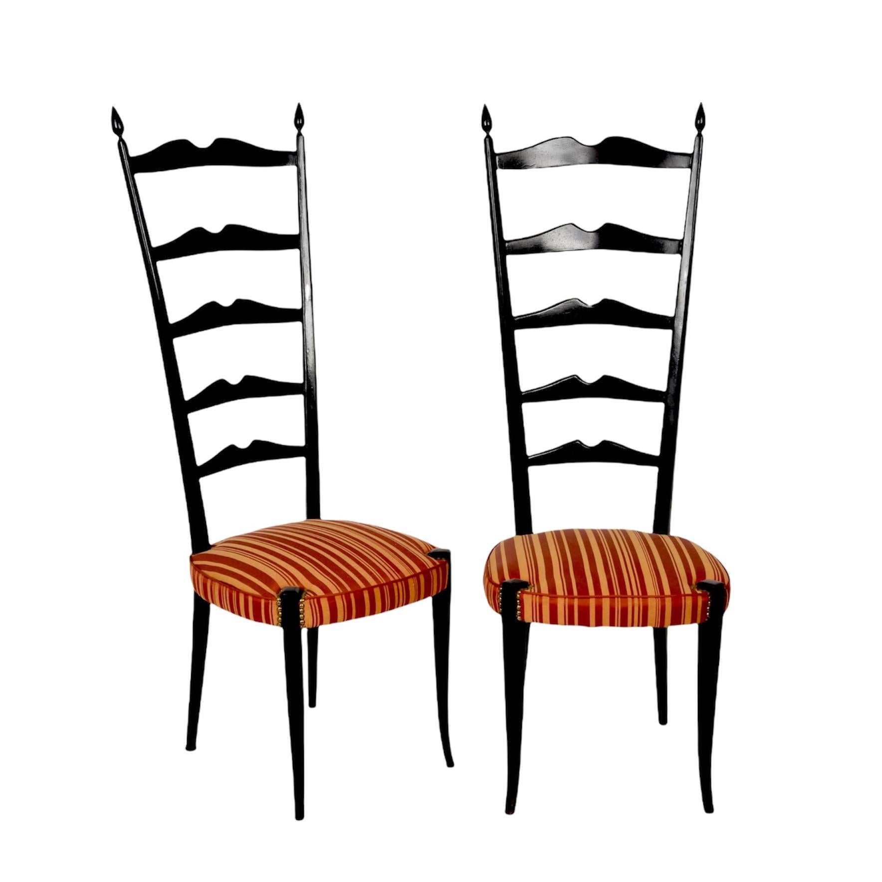 Pair of amazing high back ladder chairs in dark stained beechwood with metal spring seats and cushion. These fantastic pieces were designed by Paolo Buffa Chiavari during the 1950s in Italy.

These fantastic chairs are fantastic pieces as they