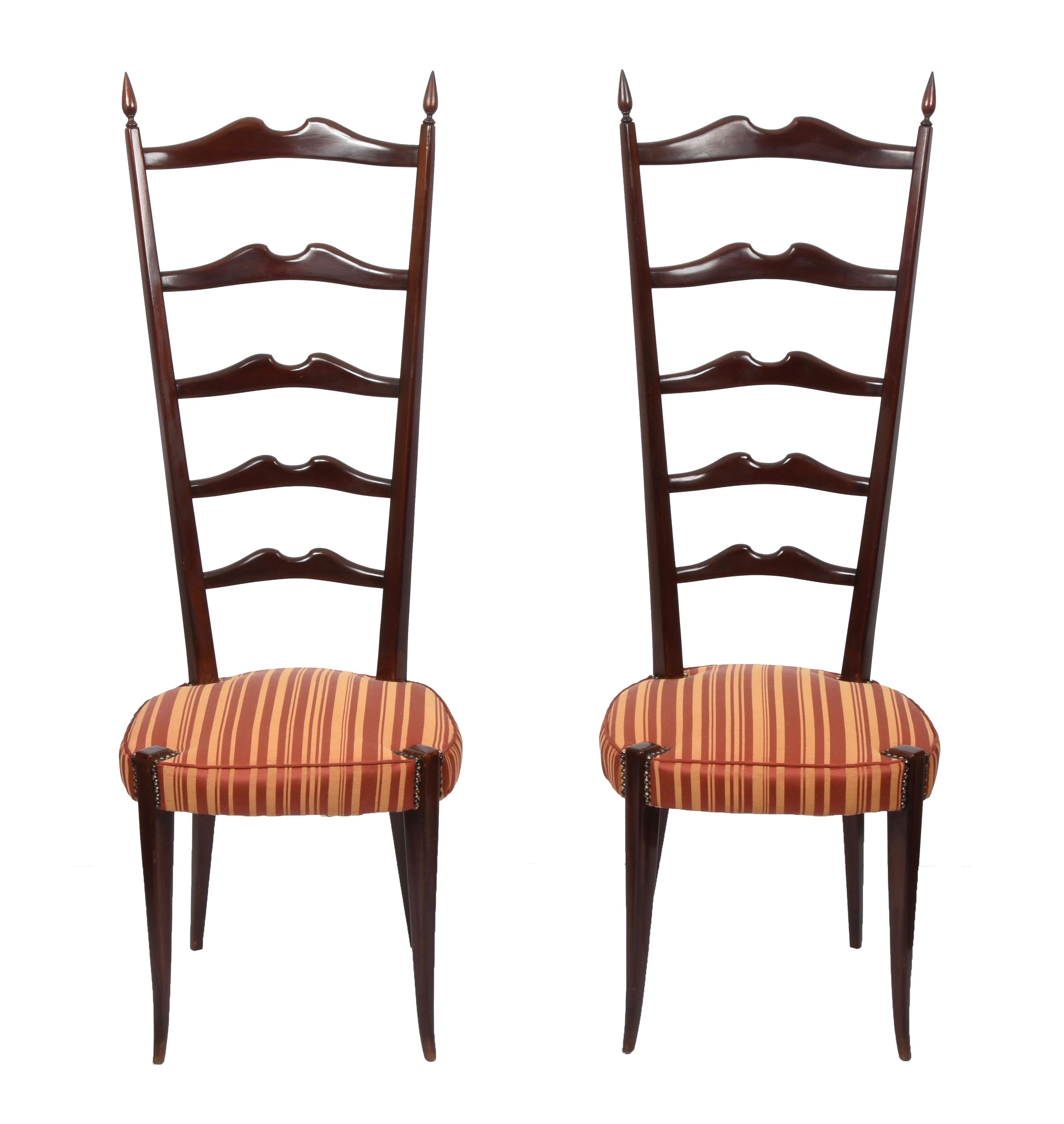 Pair of amazing high back ladder chairs in dark stained beechwood with metal spring seats and cushion. These fantastic pieces were designed by Paolo Buffa Chiavari during the 1950s in Italy.

These fantastic chairs are fantastic pieces as they