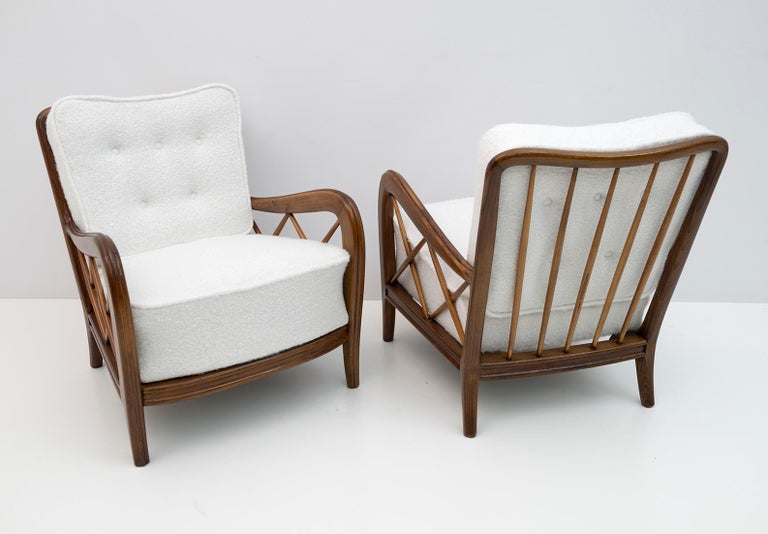 Beautiful pair of lounge armchairs designed by Paolo Buffa, Italy, 1950s. The structure is in oak wood and has been polished with shellac, maintaining the original patina. The seat and back are original of the time, with internal springs and have