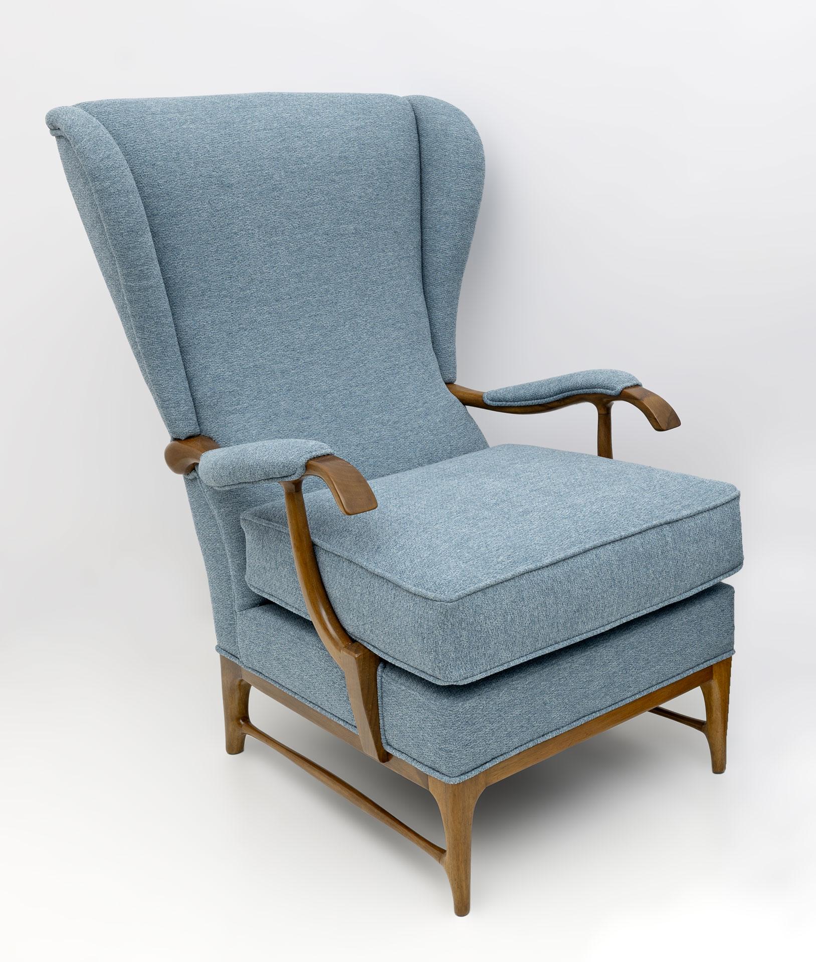 Pair of Wingback armchairs designed by Paolo Buffa and produced by Framar in the 1950s. The armchairs have been restored and upholstered with sugar paper-colored bouclé fabric. Paolo Buffa was an Italian designer and architect. He is one of the most