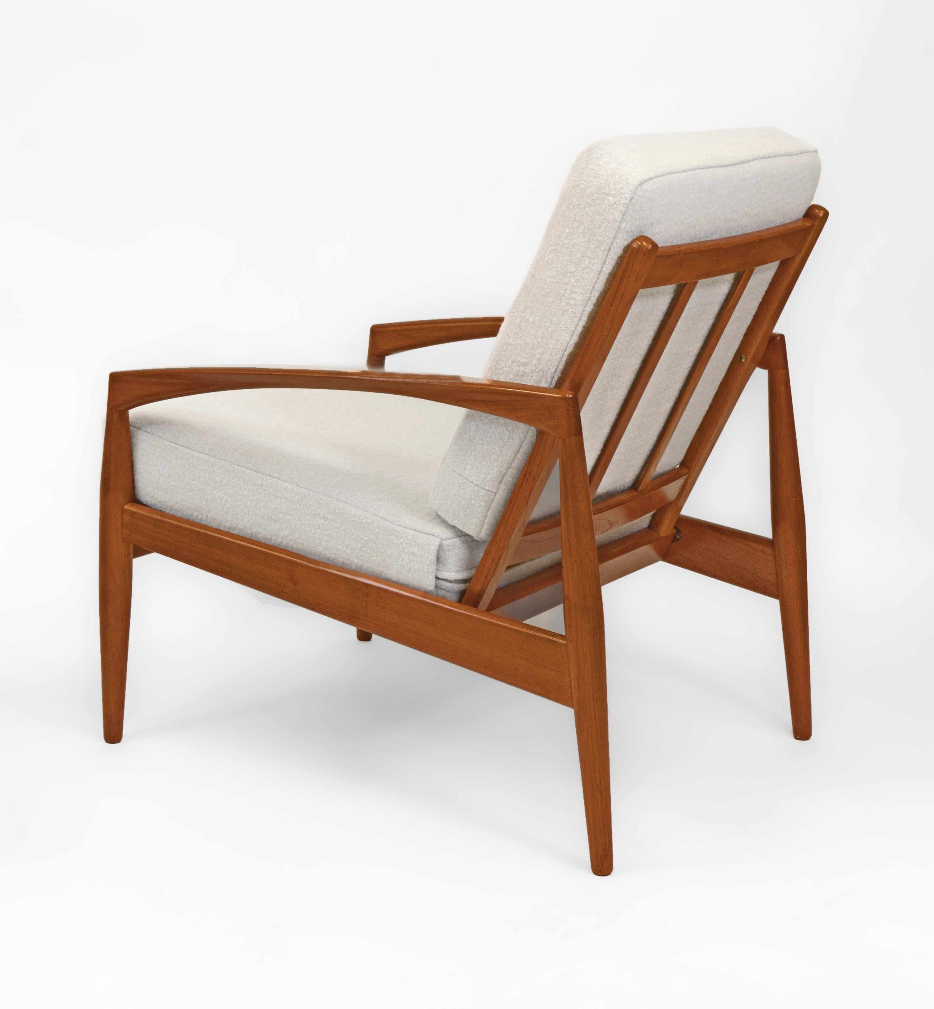 Superb pair of Danish mid century teak ‘Paper Knife’ lounge chairs designed by Kai Kristiansen for Magnus Olesen. Model 121. Maker's labels. Circa 1960.

The chairs have solid teak sleek and sculptured frames with their original finish. There are a