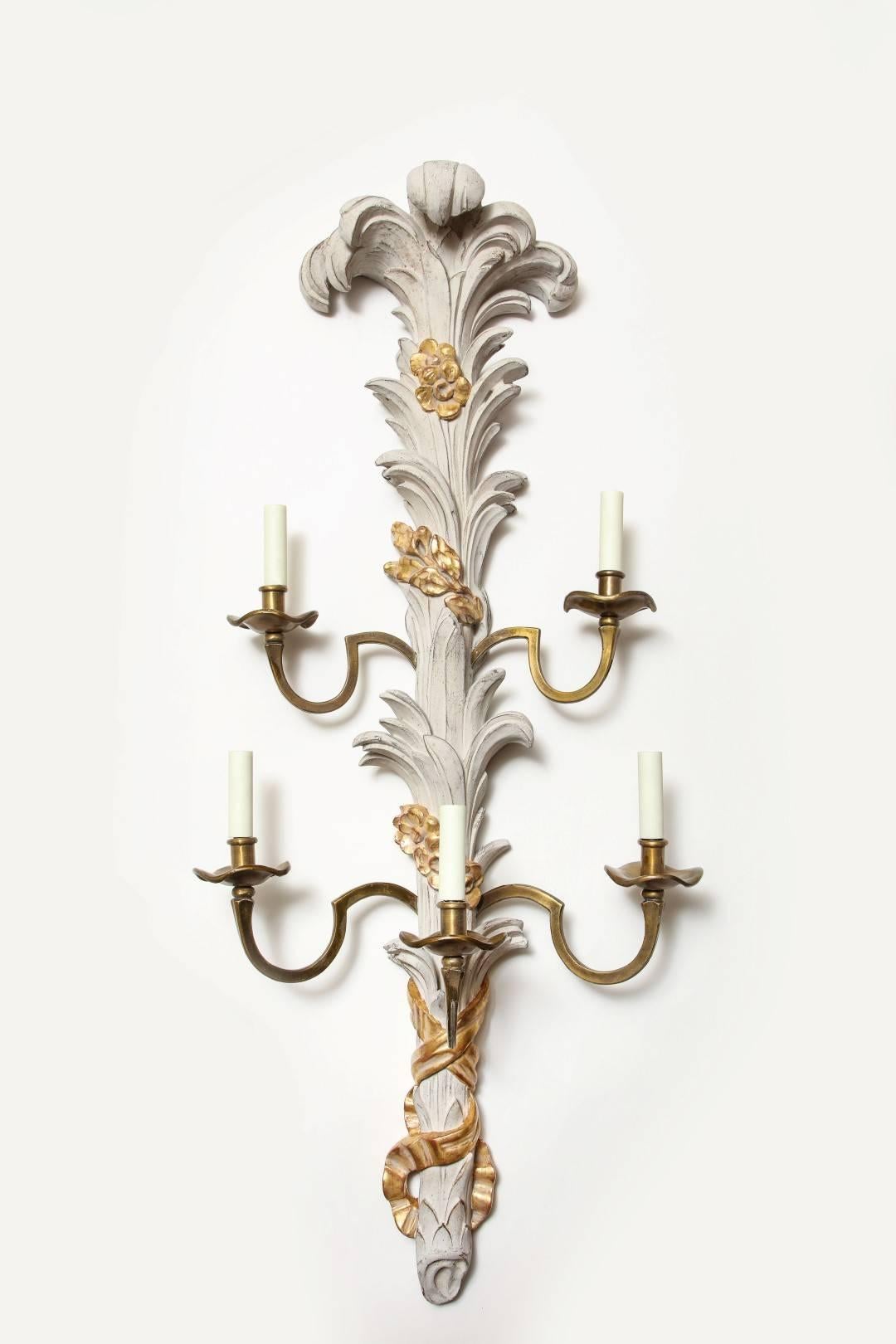 A pair of parcel-gilt, grey painted wall sconces by David Duncan. The hand carved large backplate is based on a design from the 1950s, features a gilt finish and five brass candle arms with standard wiring.
Priced per pair, with two pairs currently