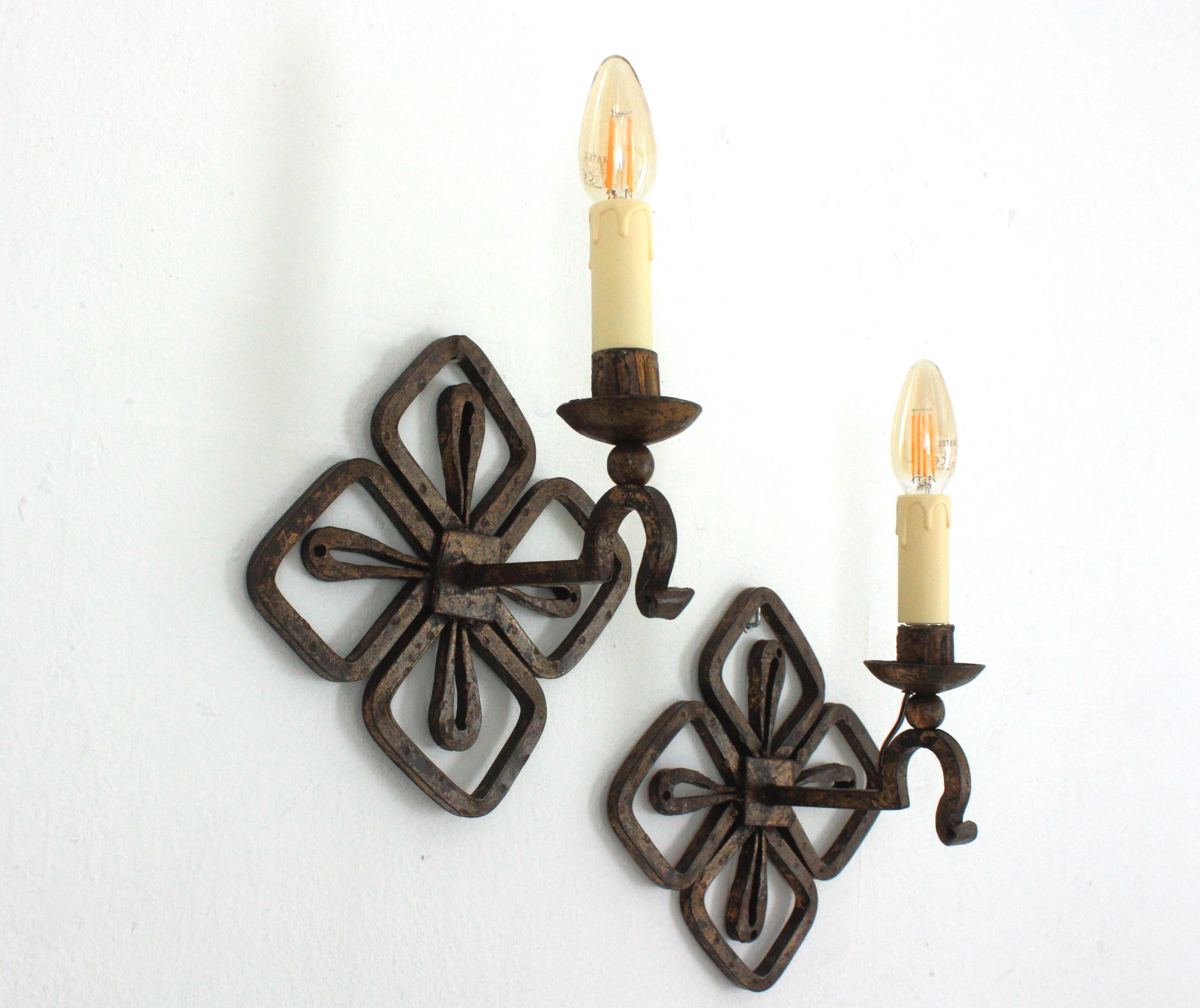 Forged Pair of Parcel Gilt Iron Wall Sconces with Fleur de Lis Design For Sale