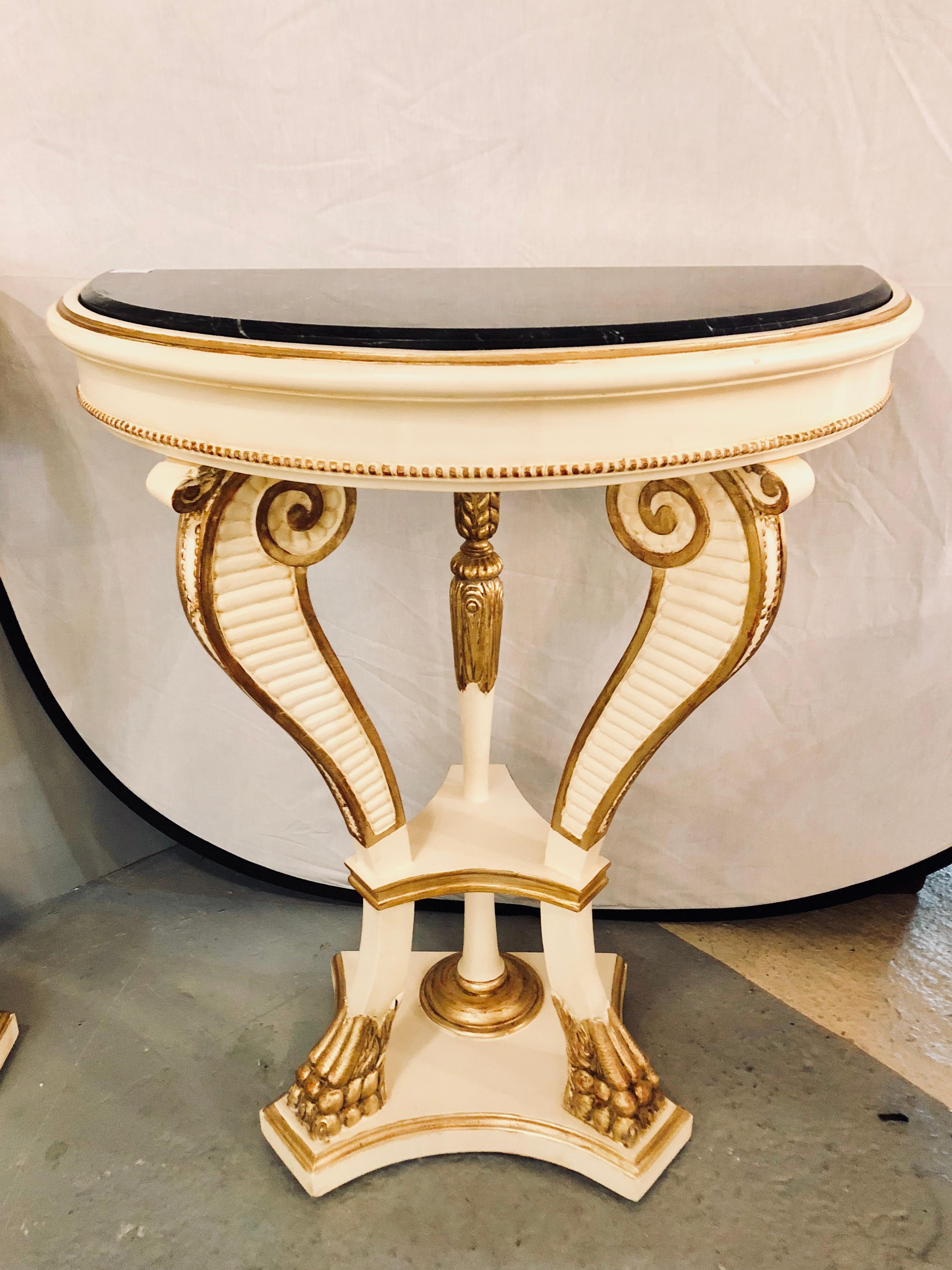 Hollywood Regency Pair of Parcel Paint and Gilt Decorated Marble-Top Demilune Console Tables