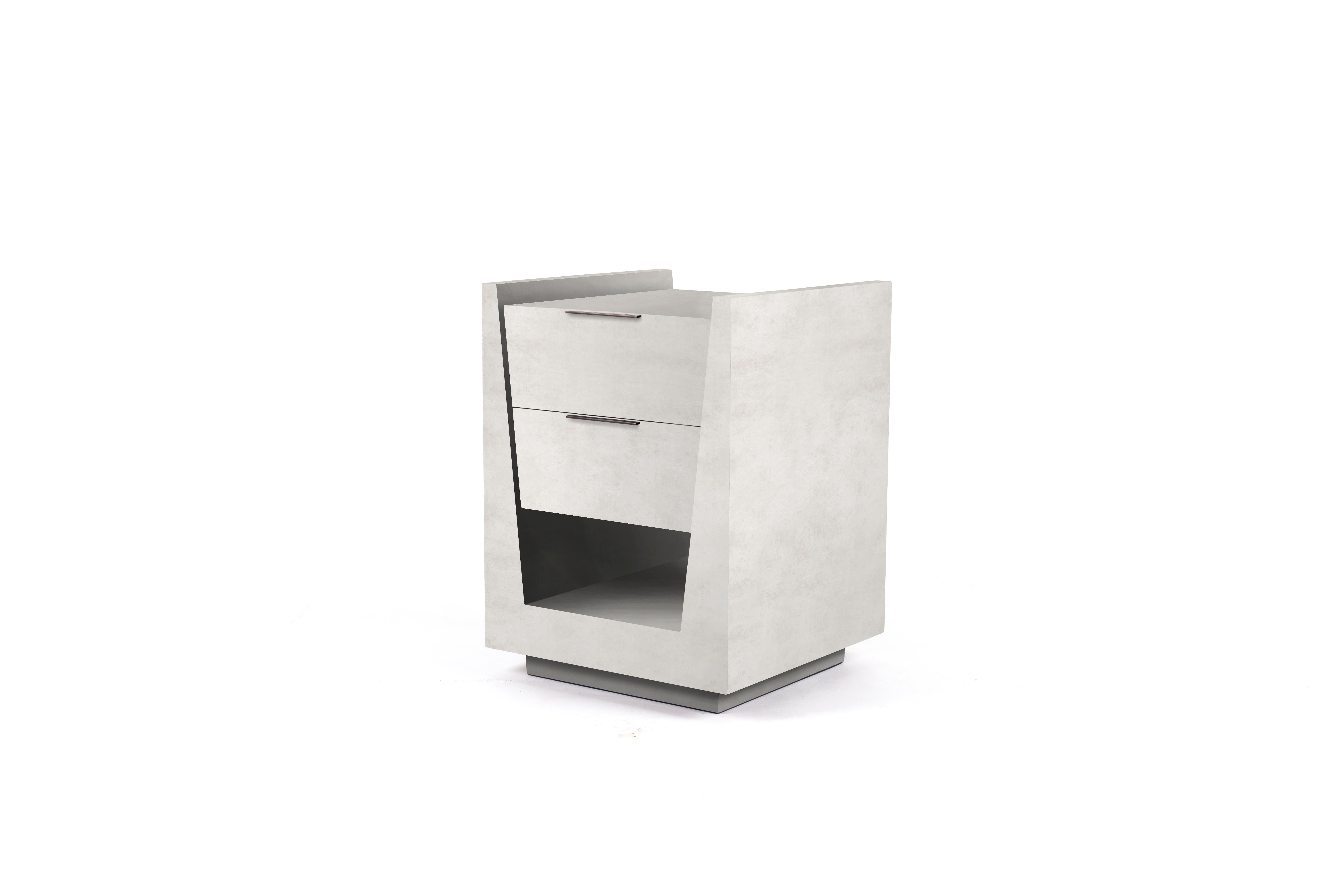 The Lola bedside by R & Y Augousti is an elegant piece with its subtle geometry. This bedside table is completely inlaid in cream parchment with discreet bronze-patina brass flat handles for the drawers. The drawers are inlaid in gemelina wood. This