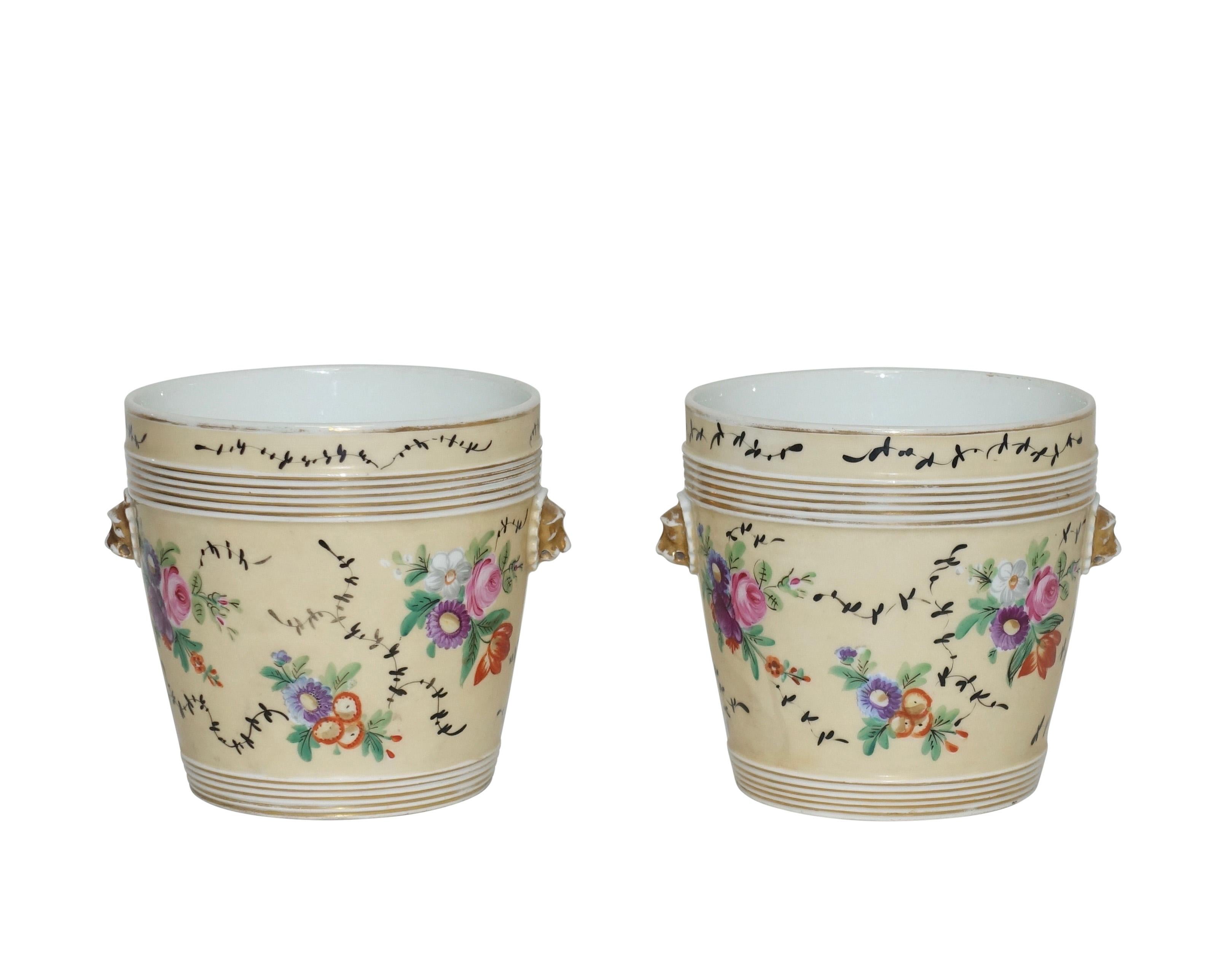 A pair of Paris porcelain cachepots with hand-painted floral decoration, France, mid-19th century.

 