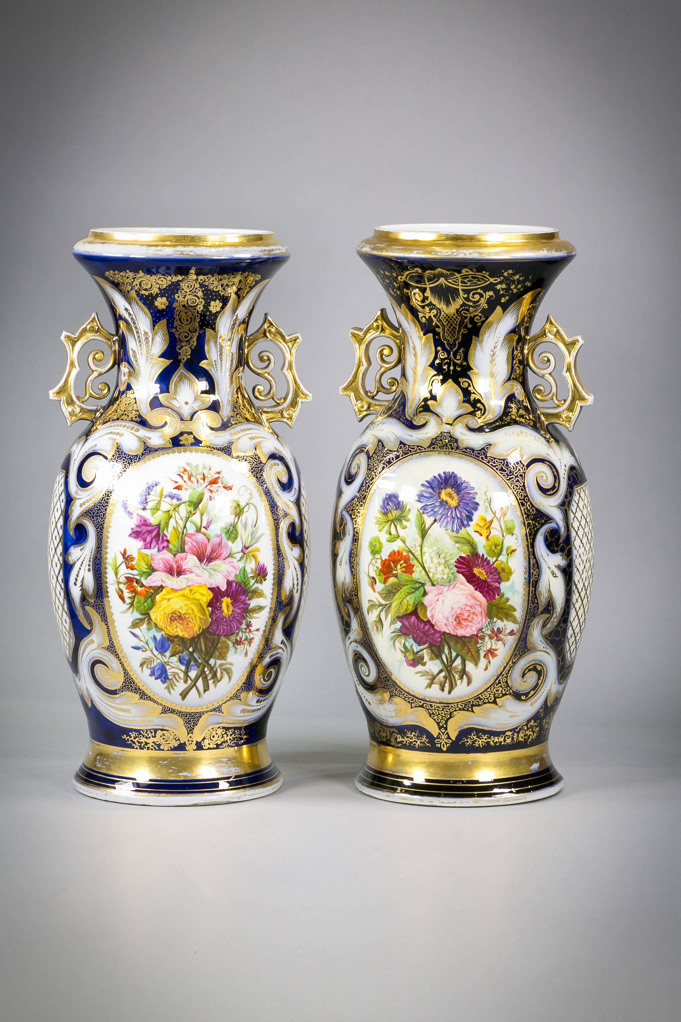 Pair of Paris porcelain two handled vases, circa 1840.