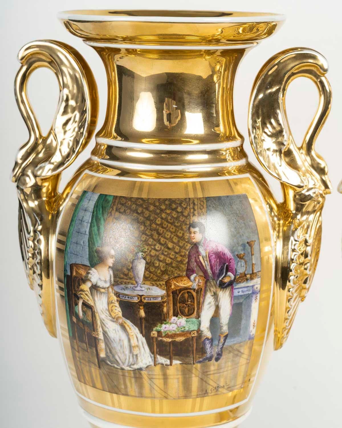 Pair of Paris porcelain vases, Empire style, 19th century, Napoleon III period.

Pair of Empire style Paris porcelain vases with painted decorations, swan neck angels, signed A. Gilbert, 19th century, Napoleon III period.
H: 46cm, W: 24cm, D: 16.5cm