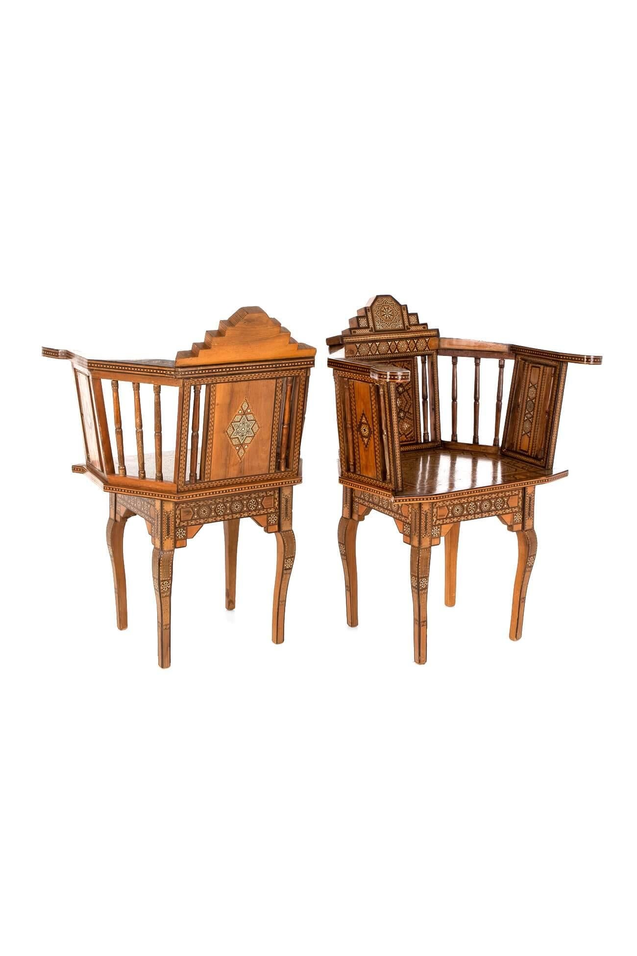 An outstanding pair of Arabian chairs made from local specimen timber and bone.

Each chair demonstrates intricate parquetry in the traditional Islamic taste, bearing geometric motifs and shapes.

Exquisitely crafted and in superb condition.