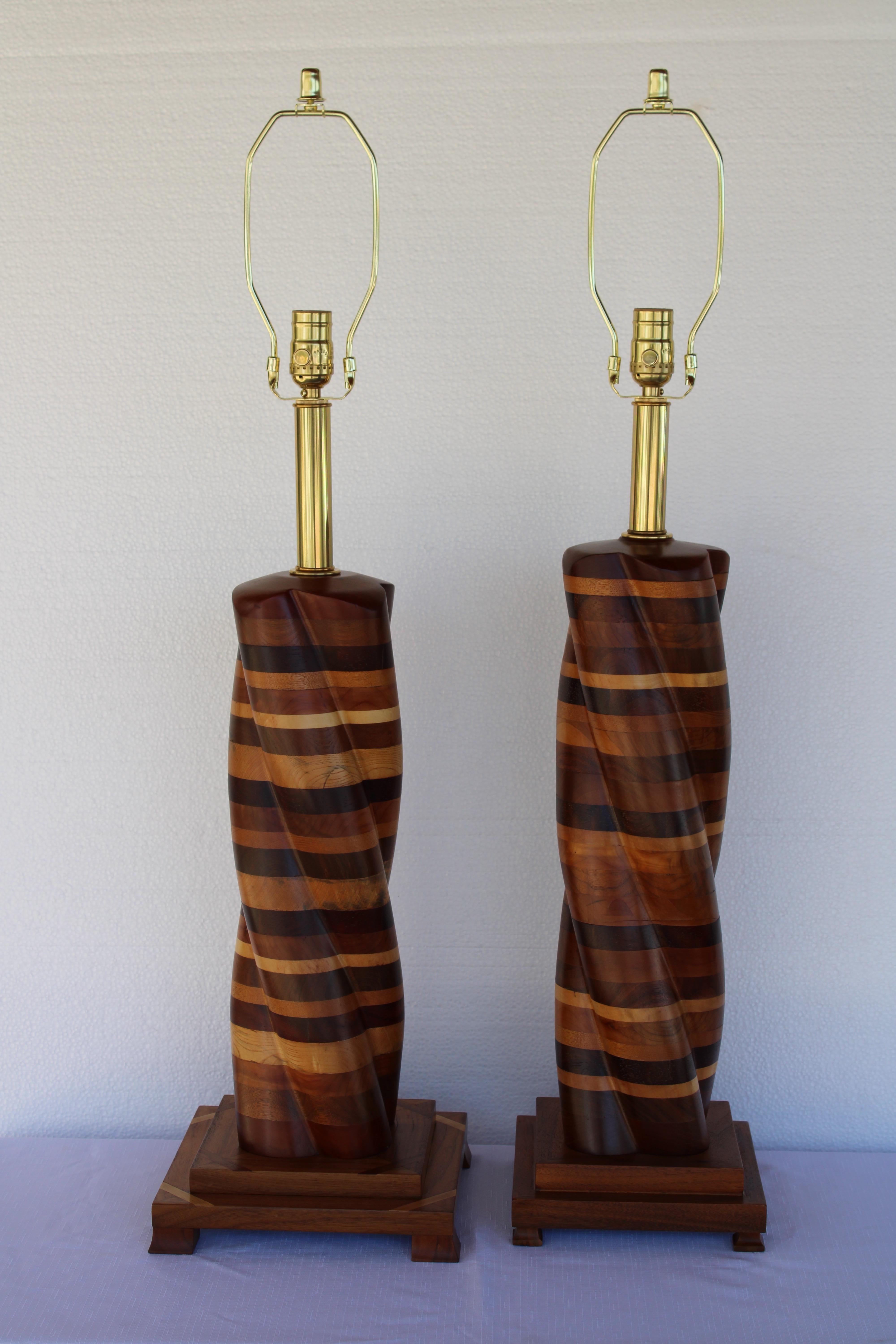 Pair of parquetry turned wood lamps.  Short lamp has a base that measures 9.25