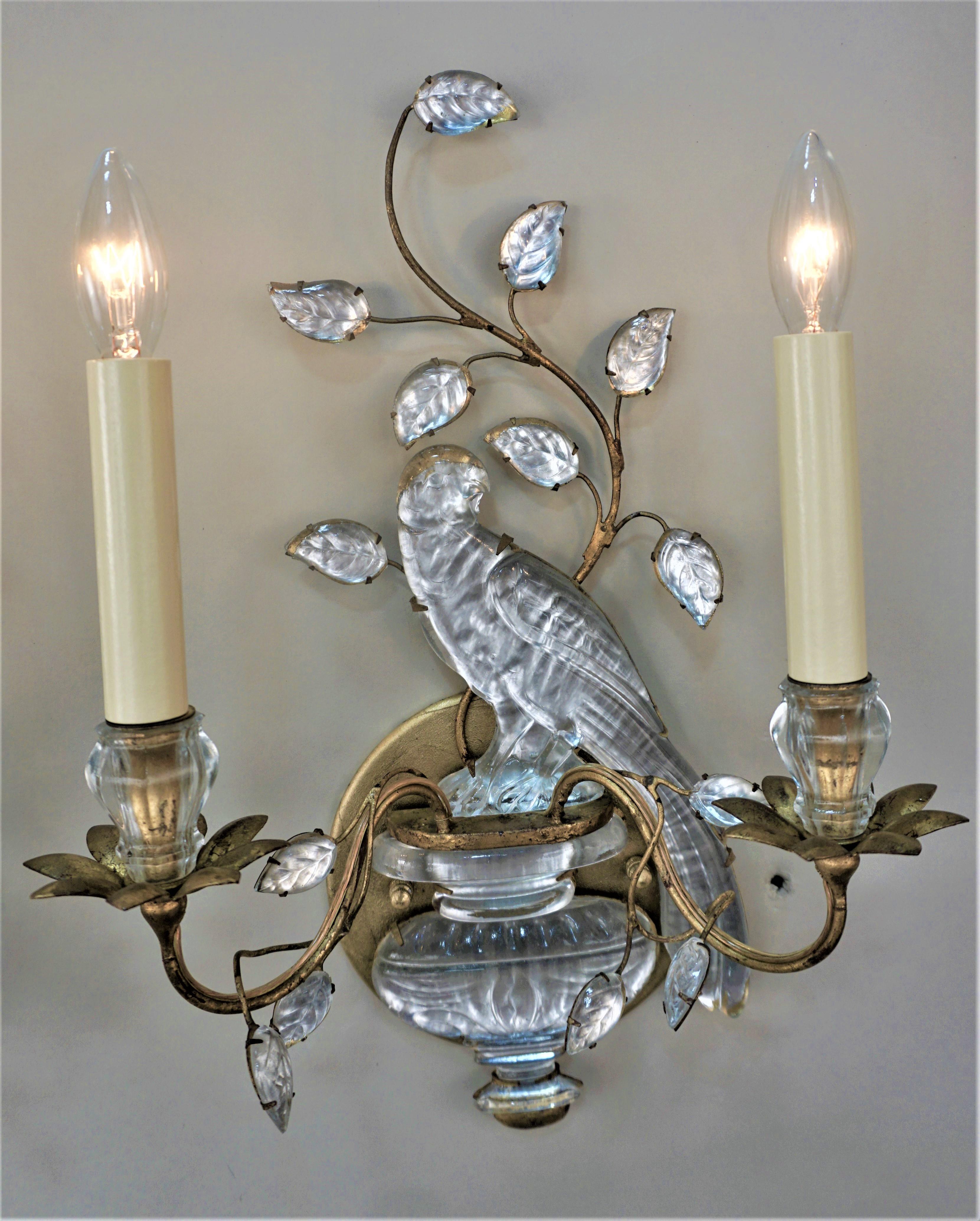 Pair of French Bagues double light wall sconces with gilt iron frames and mounted with molded glass bird over a vase.