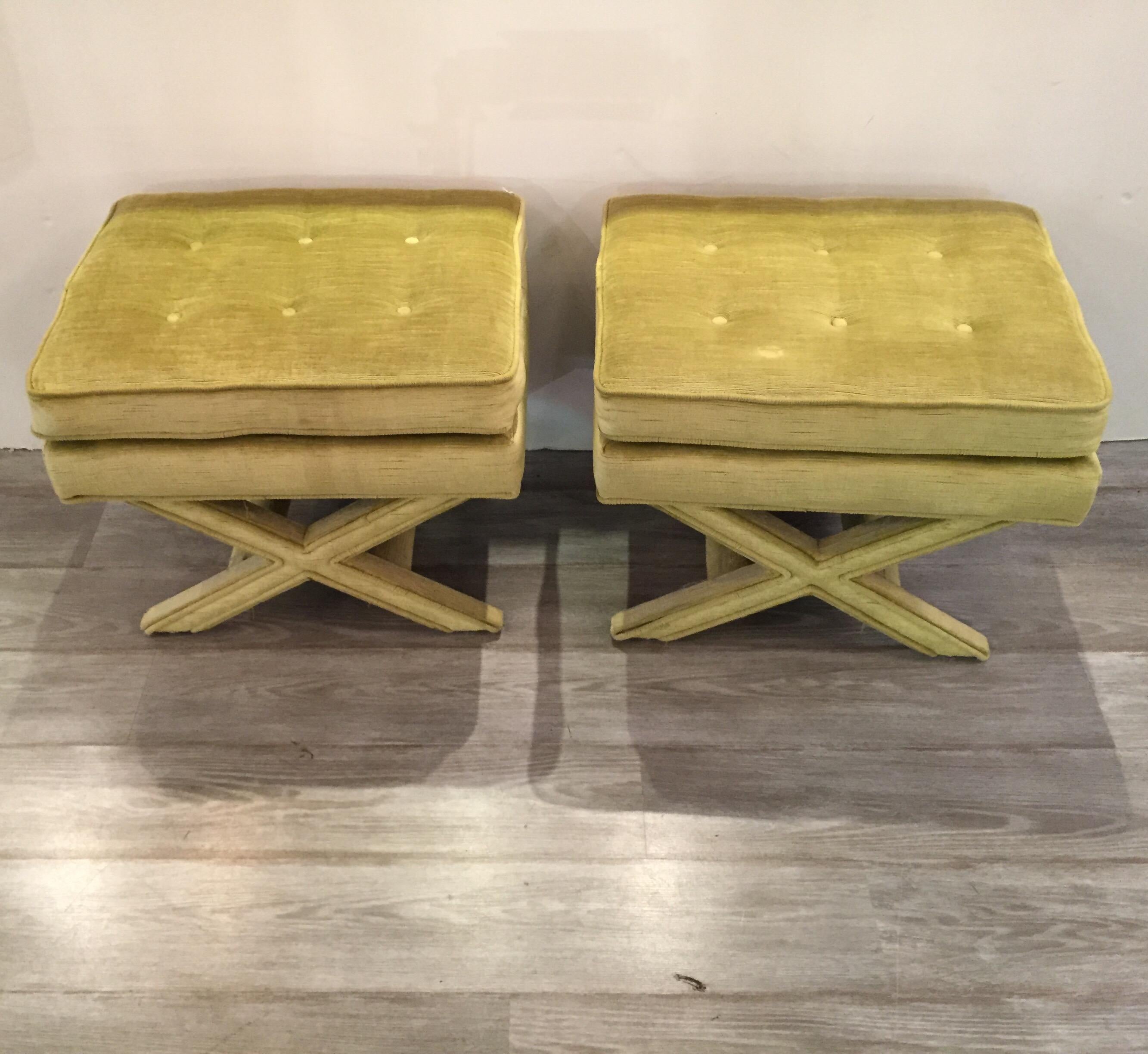 A pair of chartreuse Billy Baldwin style X Benches, the fully upholstered benches in chartreuse velvet with 6 button. Fabric in good but used condition.