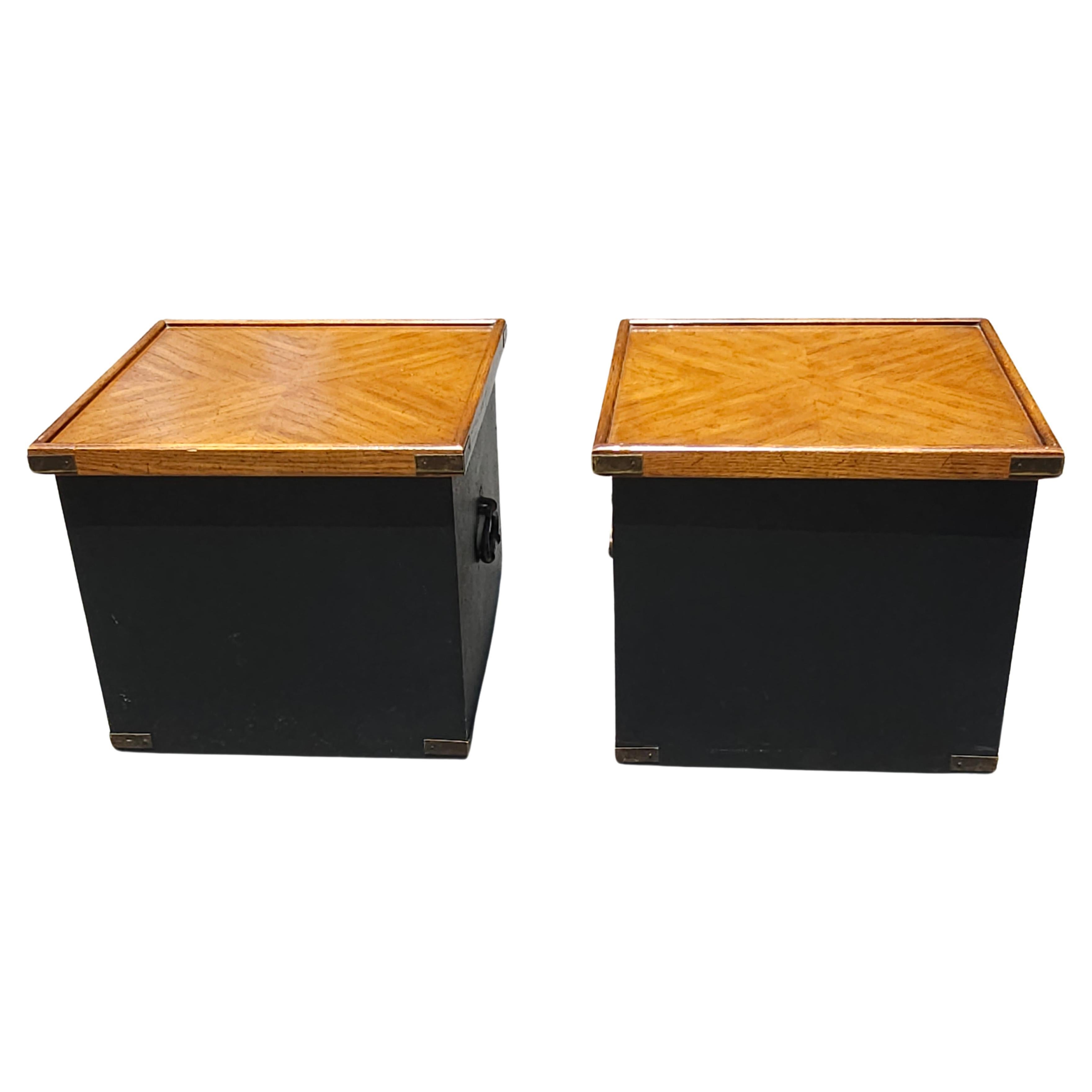 A Pair of Partially Ebonized Storage Ottomans and Walnut Bookmatched Top Side Tables.
Cover flips for use as stools / ottomans or as beautifully  bookmathed walnut top side tables.
Measure 18