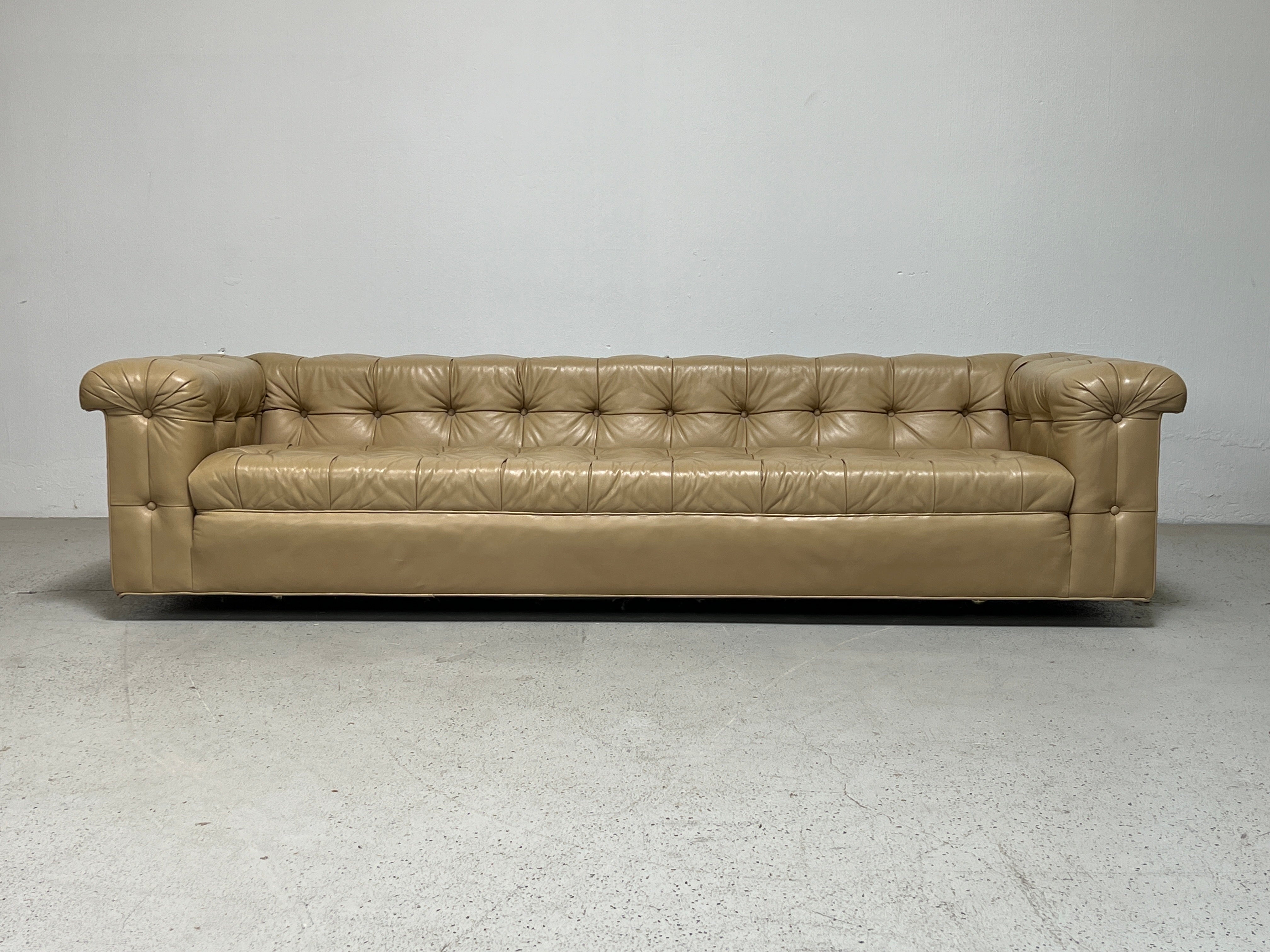 A beautiful pair of party sofas designed by Edward Wormley for Dunbar in original buttery soft light tan leather.