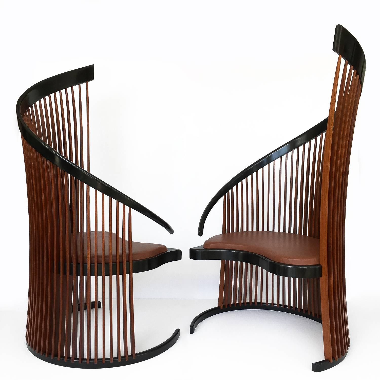 American Studio Craft Movement pair of Paso Doble sculptural high back slatted chairs by Thomas Stender. These identical chairs are designed as a separable tête-à-tête and their inspired design suggests flamenco dancers. Thomas Stender draws