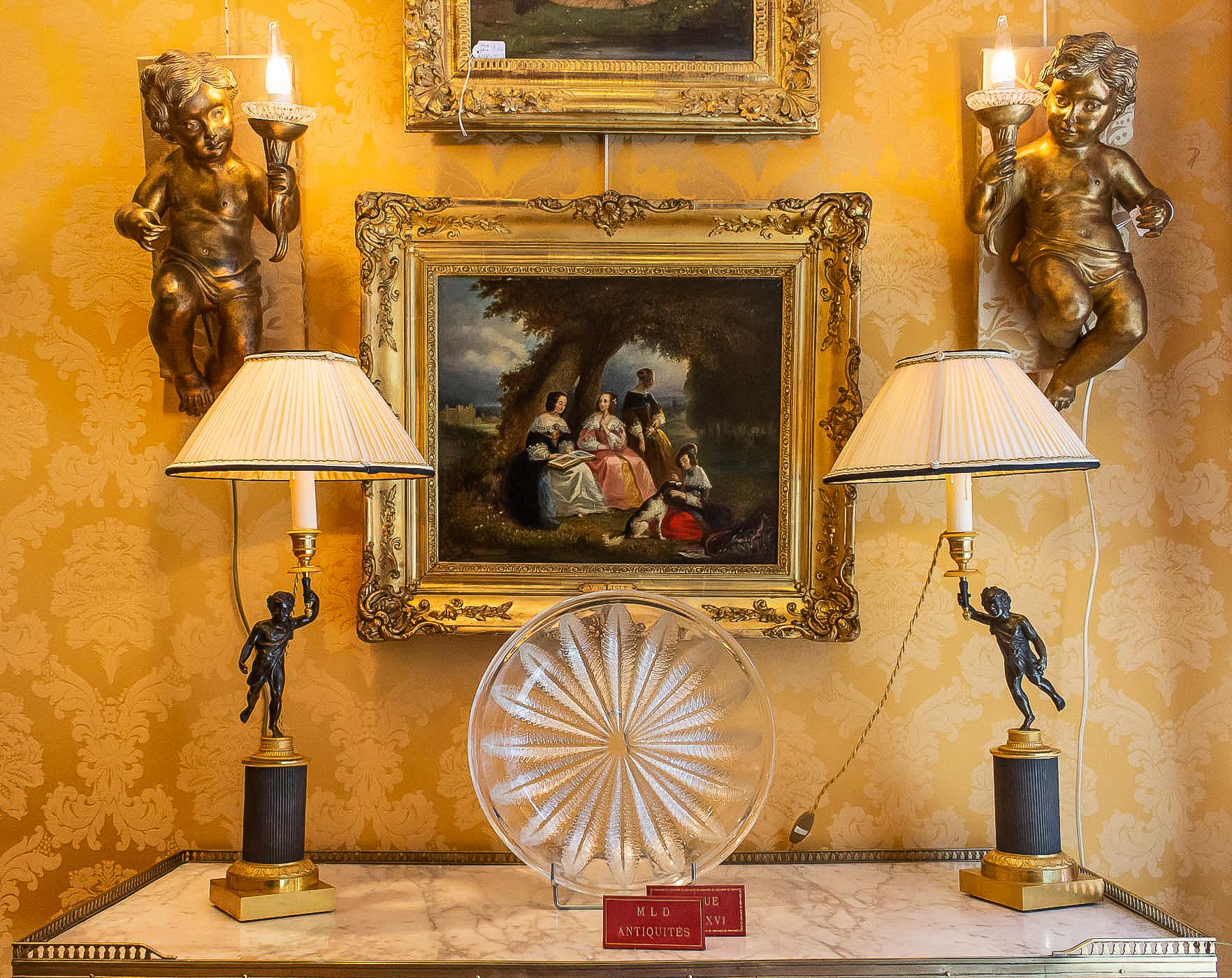 French Louis XVI style, pair of patinated and gilded candlesticks, converted in table lamps.

A nicely elegant pair of finely chiseled mercury-gilt and patinated bronze candlesticks depicting antique Faun, resting on gilt and patinated bronze