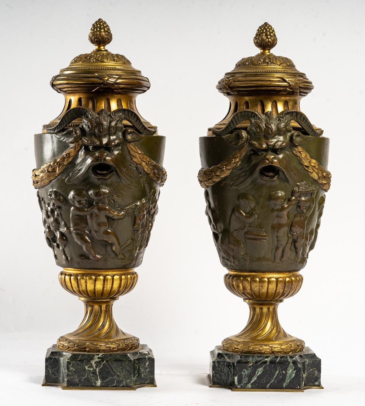 Pair of Patinated and Gilt Bronze Cassolettes, Marble Base, 19th century, Napoleon III period.
H: 42 cm, W: 19 cm, D: 15 cm