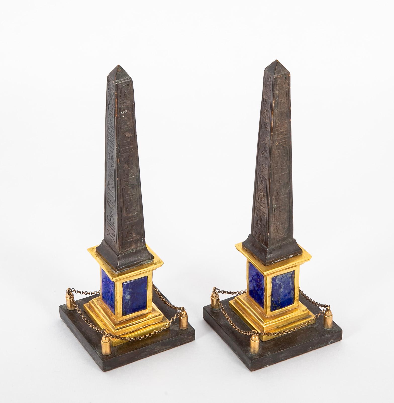 Pair of 19th century patinated and gilt hieroglyphed Roman obelisks having lapis lazuli panel inserts in base.