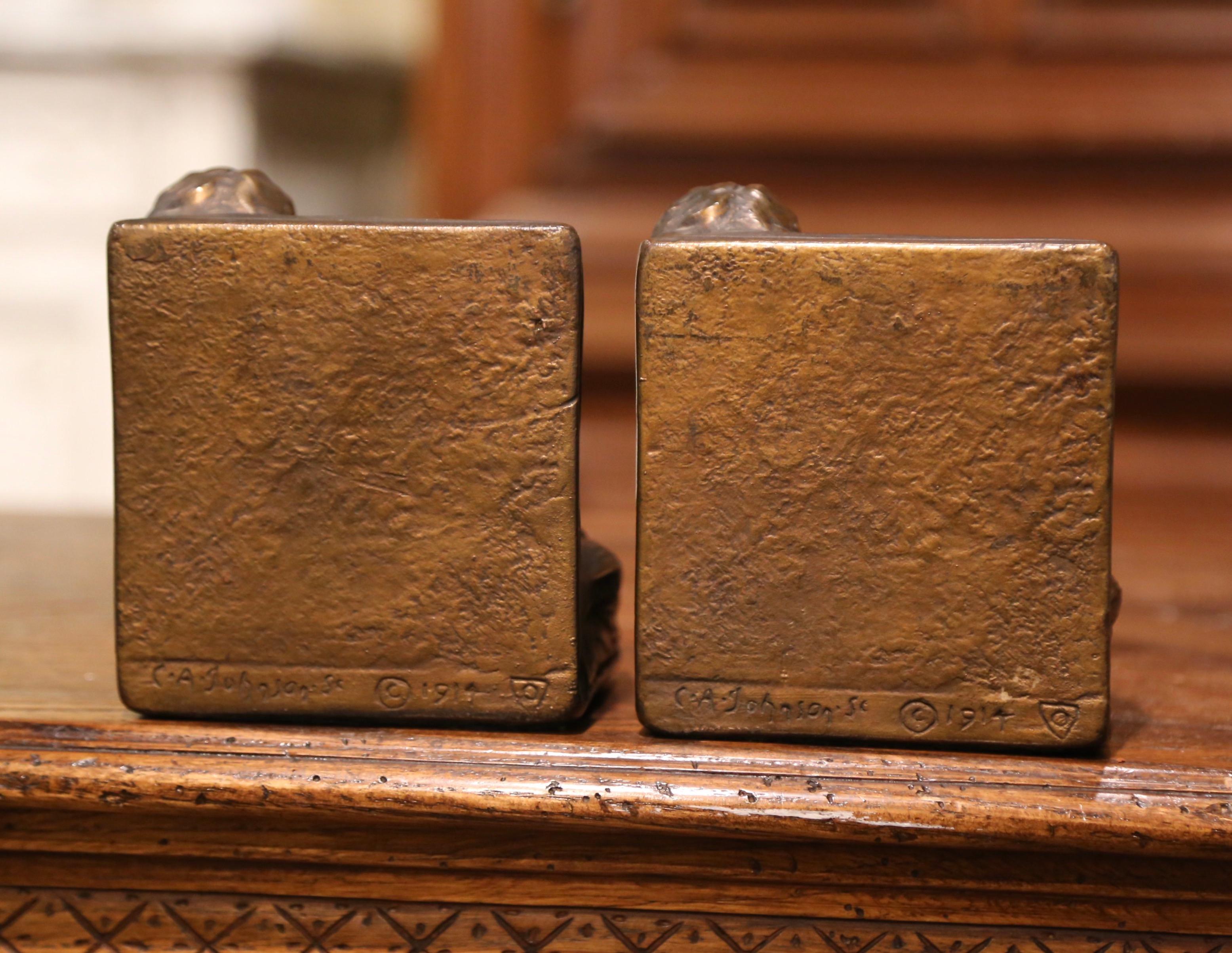 Pair of Patinated Armor Bronze Cherub Bookends Signed and Dated CA Johnson 1914 In Excellent Condition In Dallas, TX