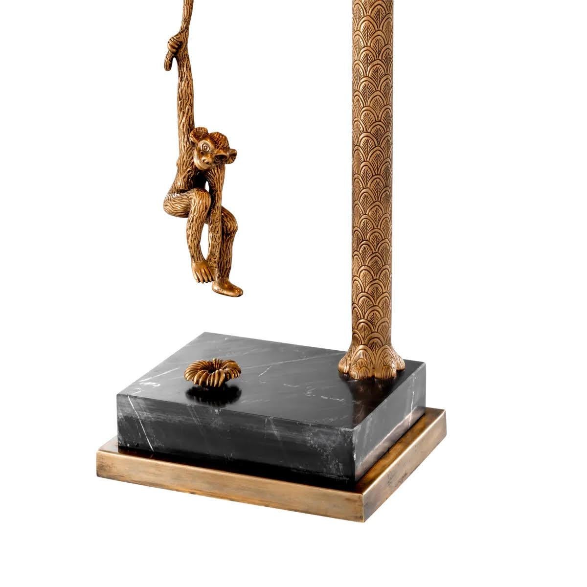 French Pair of Patinated Brass and Black Marble Table Lamps. For Sale
