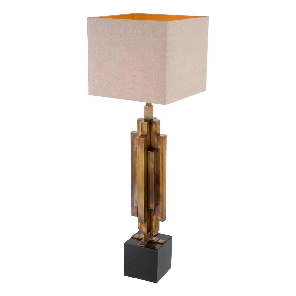 Pair of patinated brass table lamps, granite base, artistic design

Give your interior much more than just a source of light with this pair of table lamps.
Featuring a stainless steel structure with a patinated brass finish on a cubic black granite