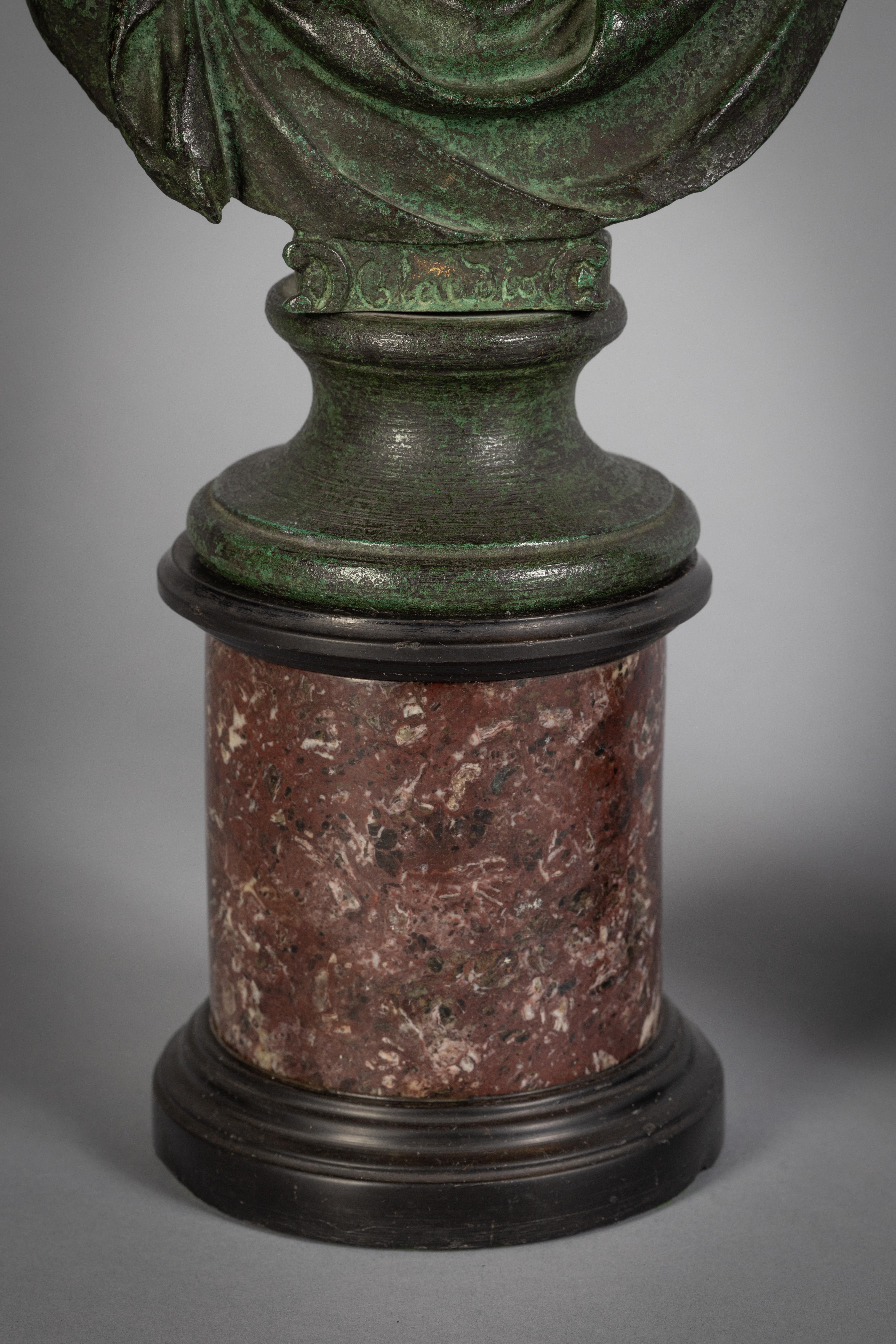 Pair of patinated bronze busts on marble stands, circa 1800.