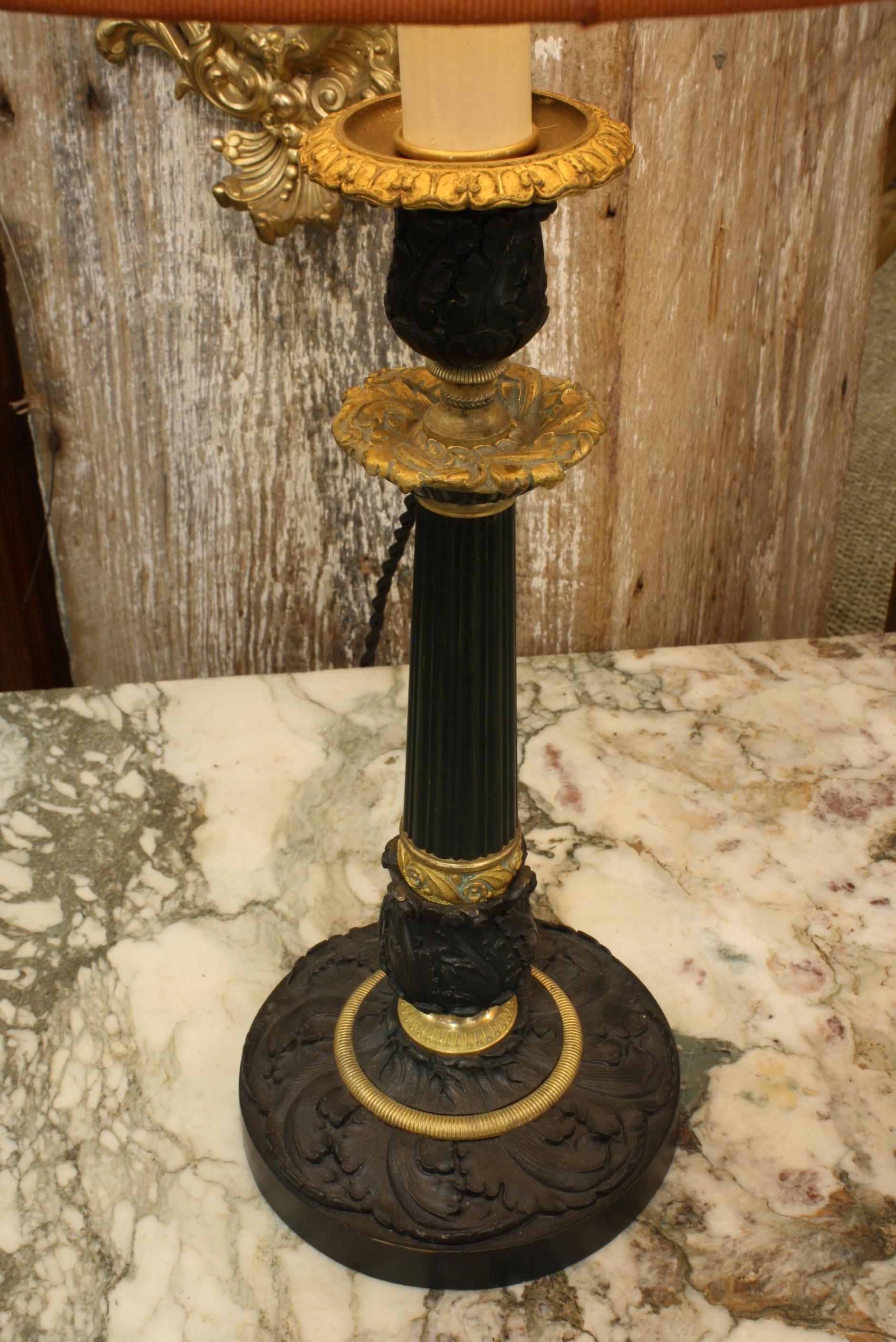 Pair of Gilt and Patinated Bronze Candlestick Lamps with Orange Silk Shades In Good Condition For Sale In Pembroke, MA