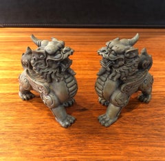 Pair of Patinated Bronze Chinese Foo Dogs