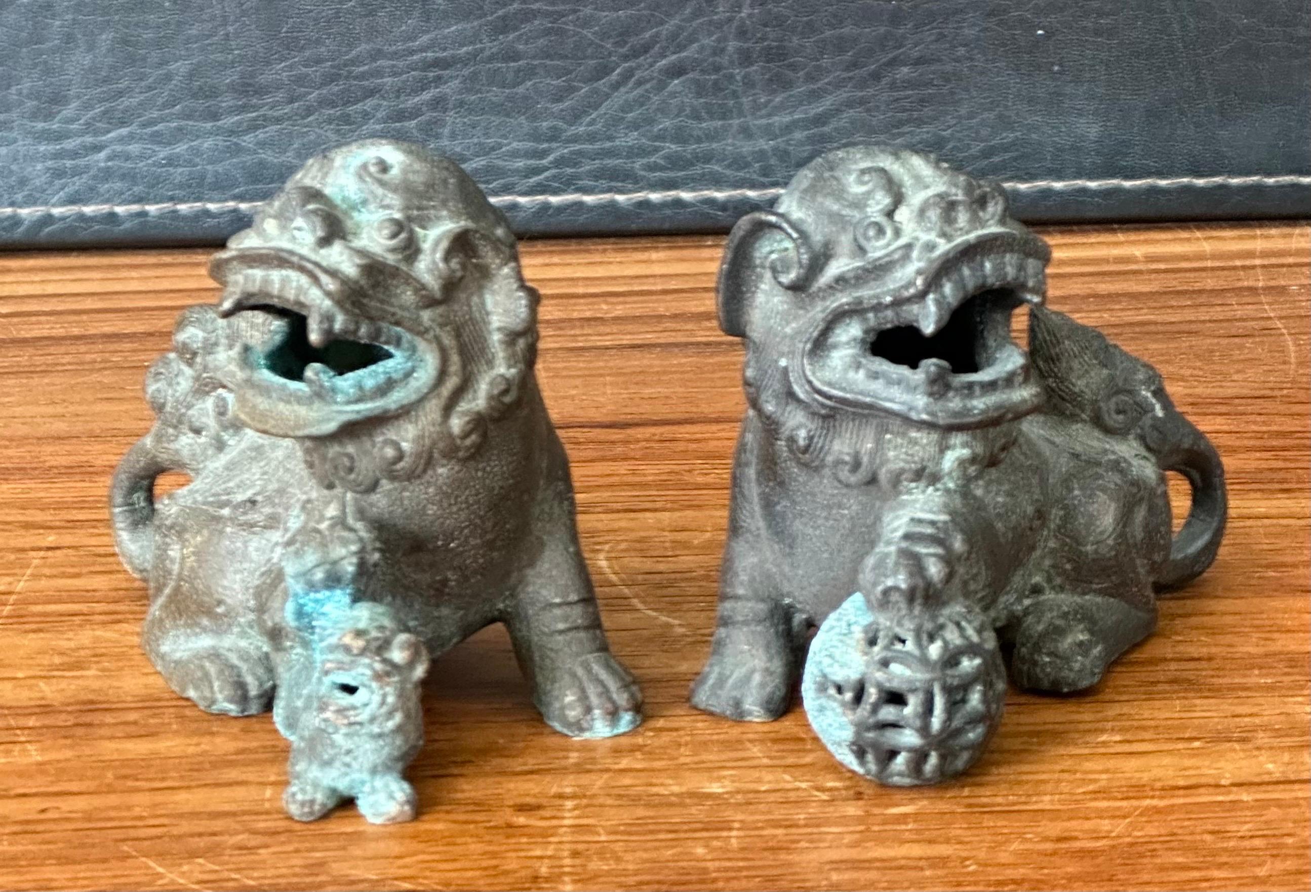Pair of Patinated Bronze Chinese Foo Dogs 1