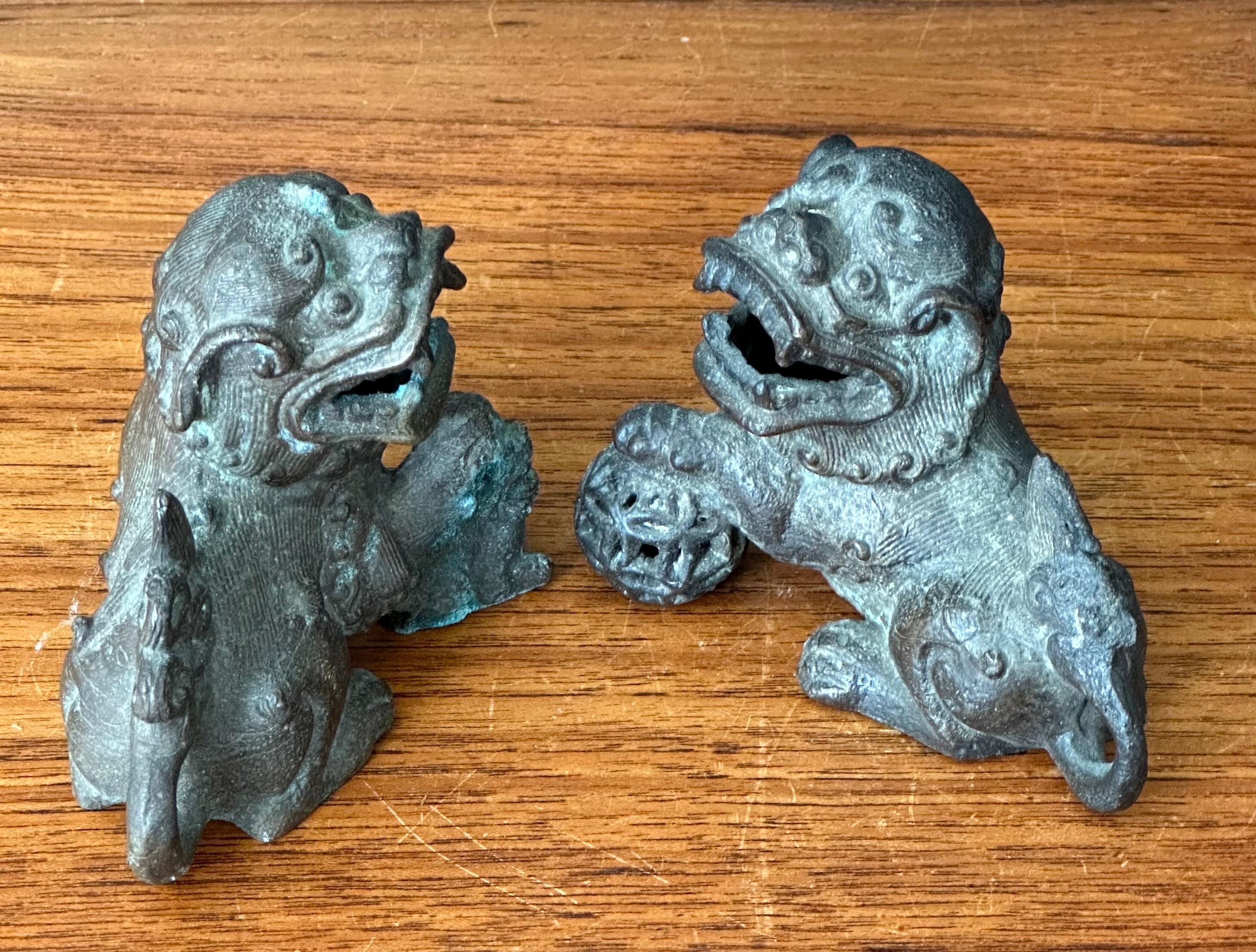 Pair of Patinated Bronze Chinese Foo Dogs For Sale 4