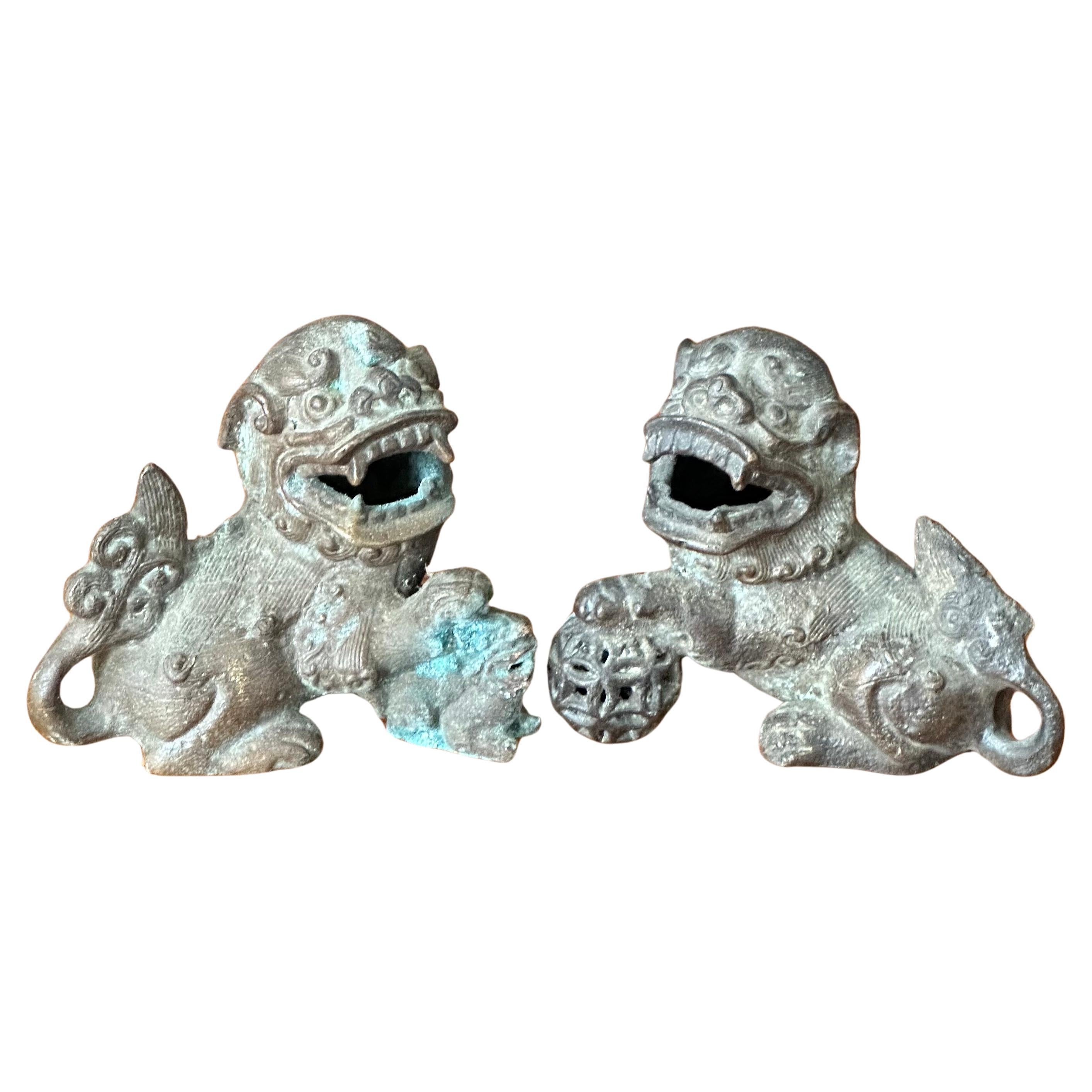 Pair of Patinated Bronze Chinese Foo Dogs For Sale