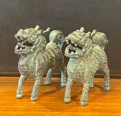 Pair of Patinated Bronze Chinese Foo Dogs with Verdigris Finish