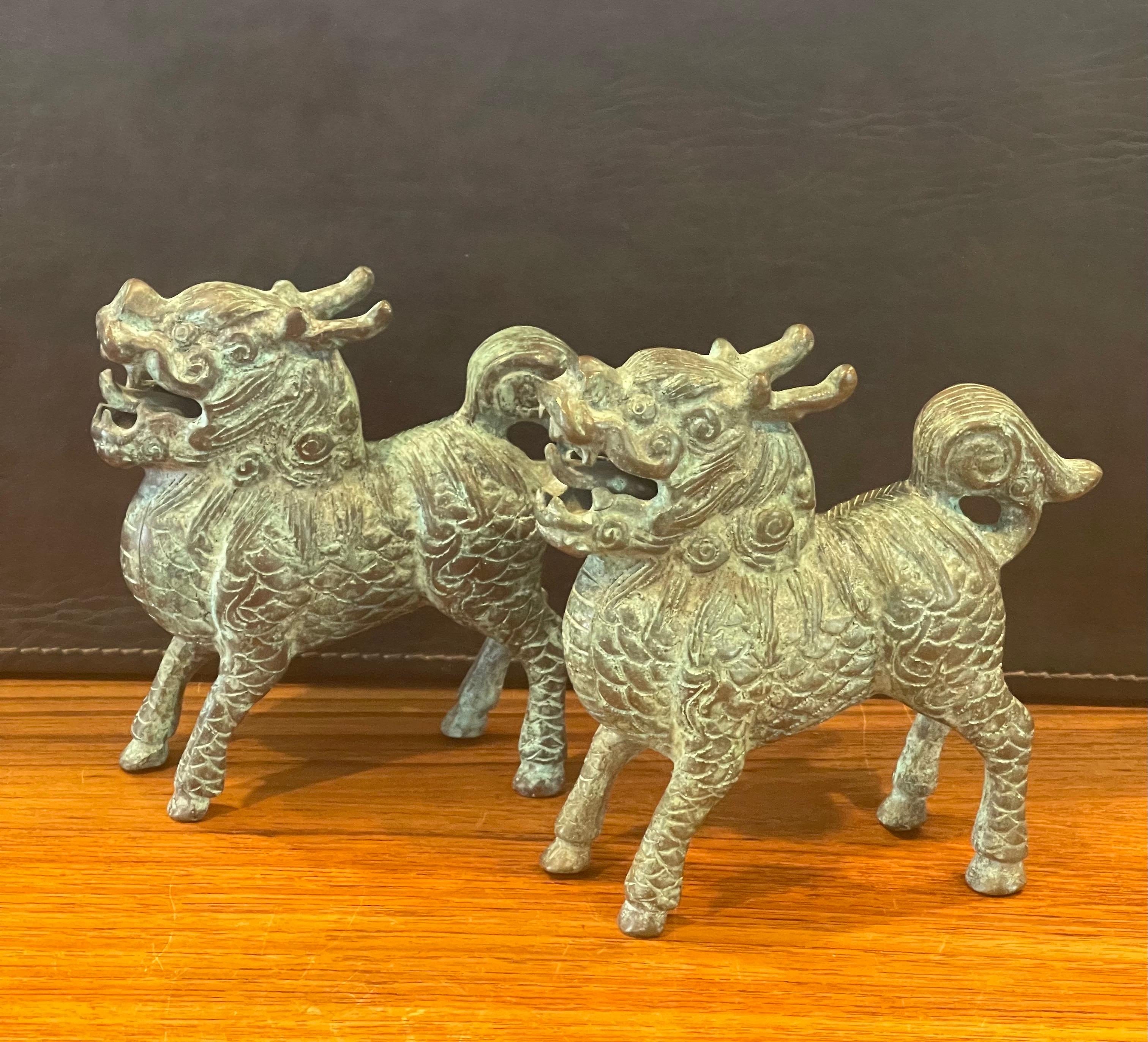 Mid-Century Modern Pair of Patinated Bronze Chinese Foo Dogs with Verdigris Finish For Sale