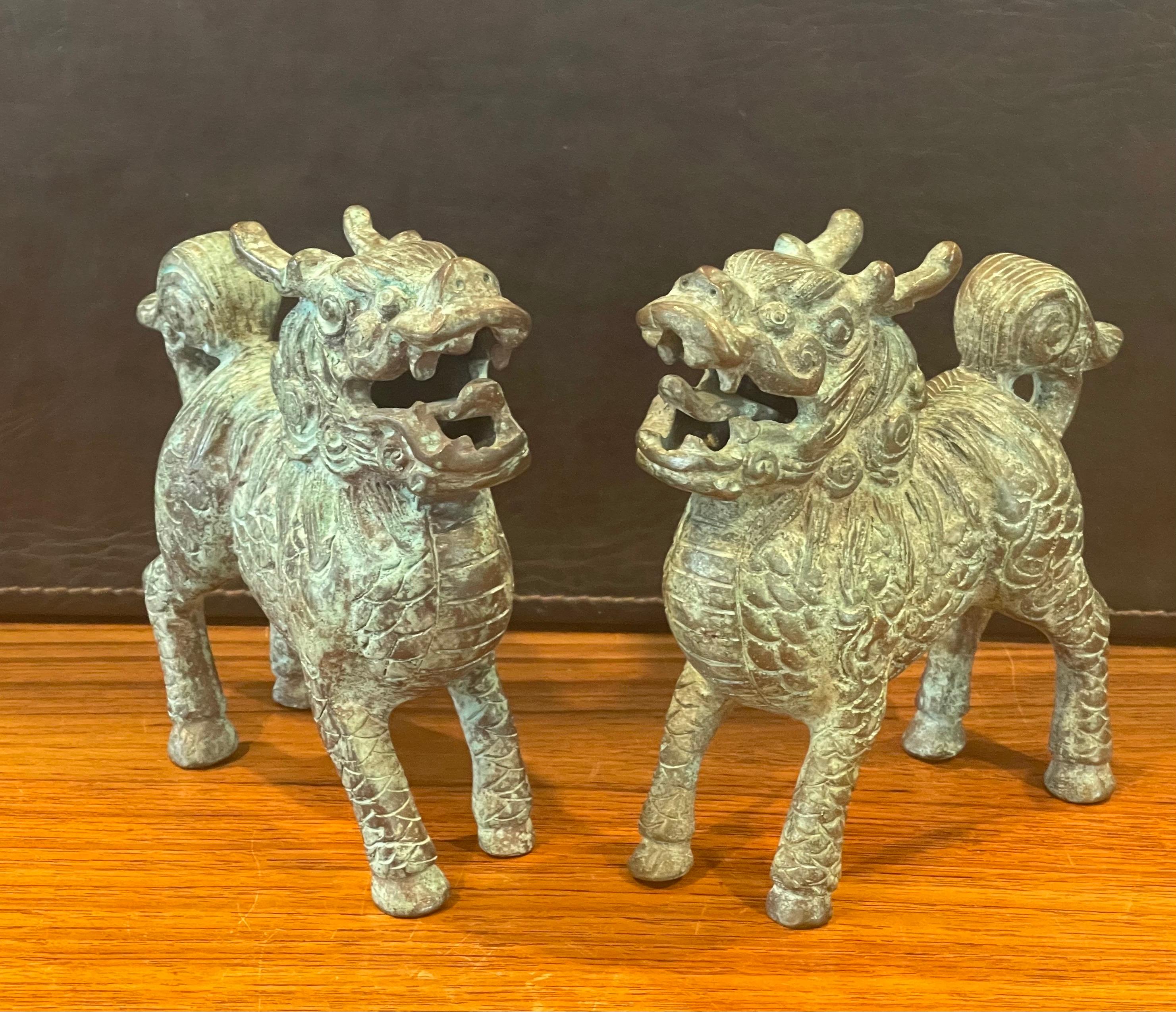 Pair of Patinated Bronze Chinese Foo Dogs with Verdigris Finish In Good Condition For Sale In San Diego, CA