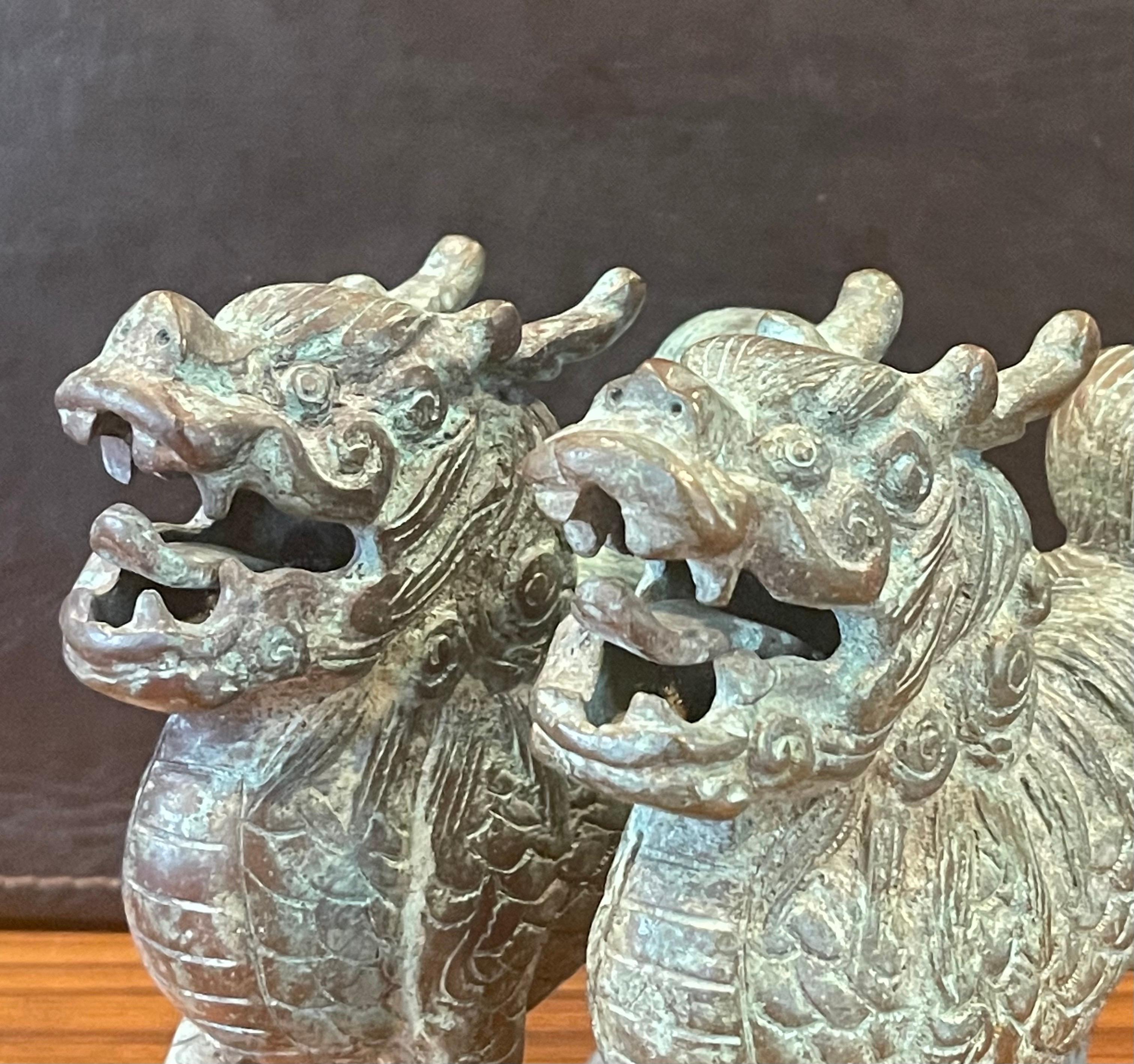 Pair of Patinated Bronze Chinese Foo Dogs with Verdigris Finish For Sale 3