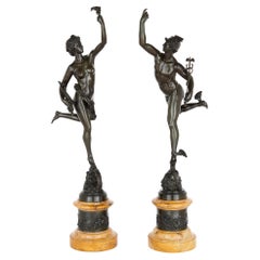 Pareja de figuras de bronce patinado según Giambologna