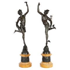 Paire de figures en bronze patiné d'après Giambologna