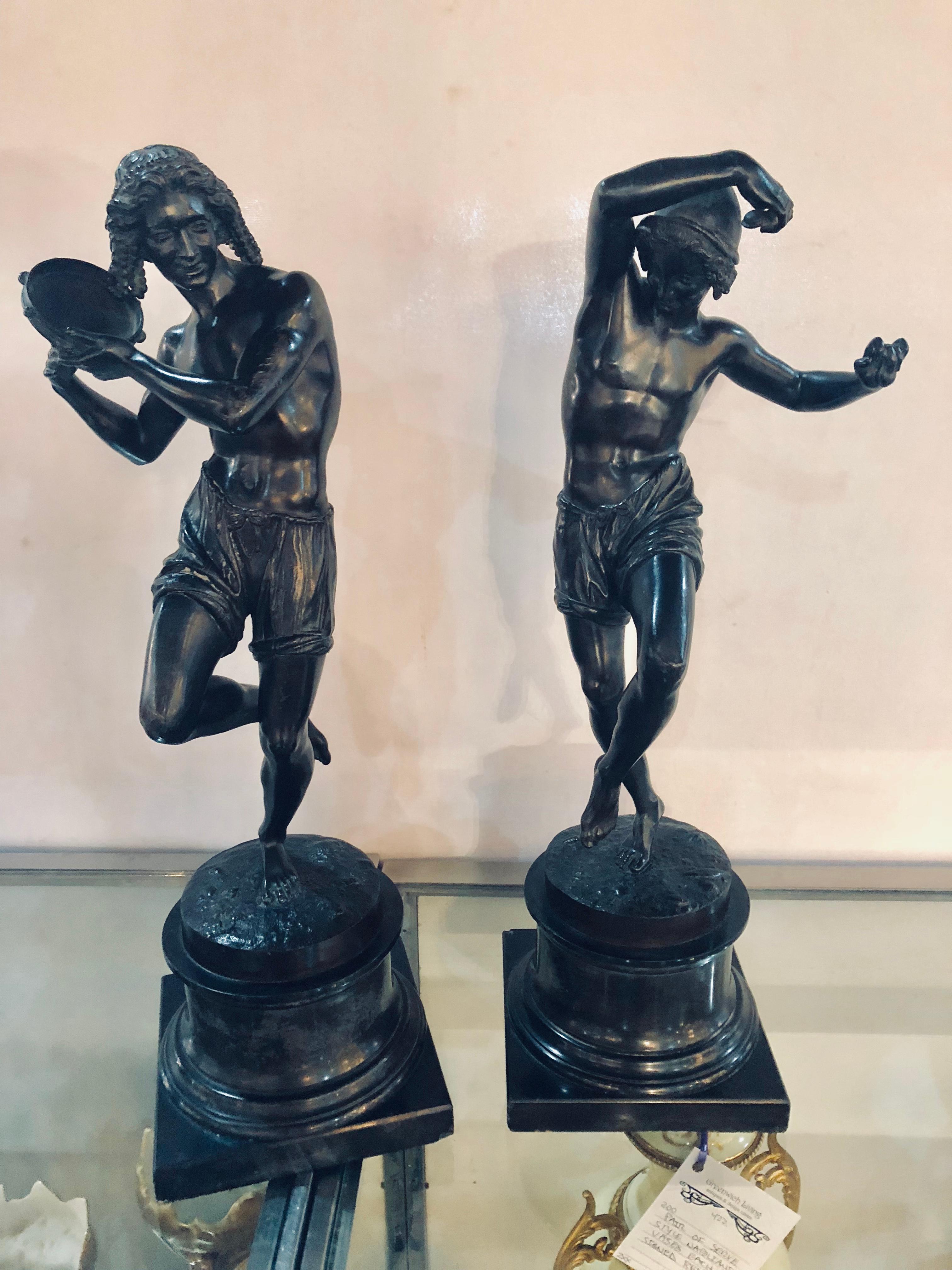 Pair of patinated bronze figures of male dancers signed Duret, Neapolitan fisher dancing the Tarantella, 1833 and Delafontaine. Each mounted on a truncated marble pedestal. Height overall 21 1/2 inches, height of figures 17 inches. Figure with