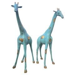 Coppia di sculture di giraffa in bronzo patinato, 20° secolo